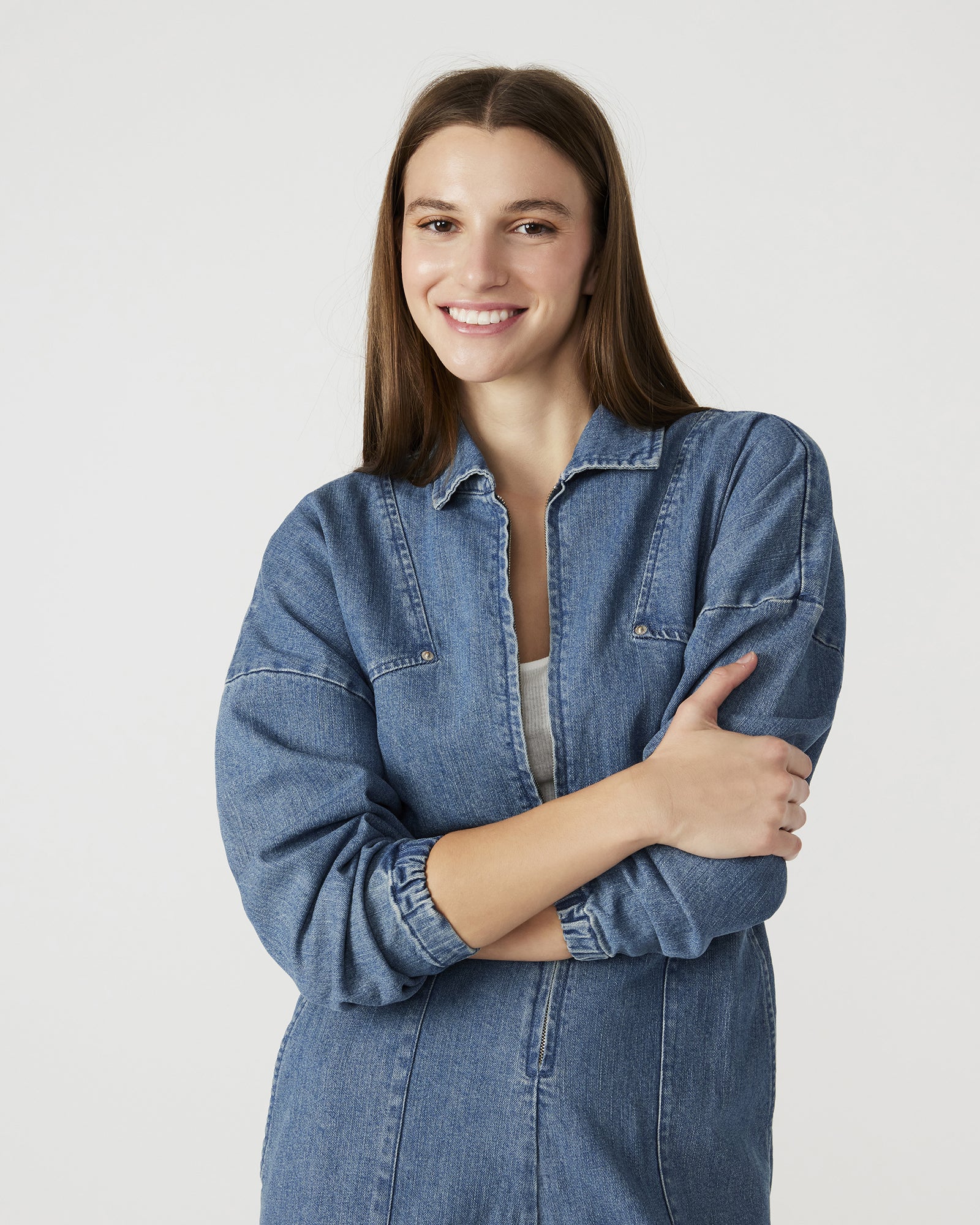 Front view of the Trista long sleeve denim jumpsuit showcasing its zip closure.