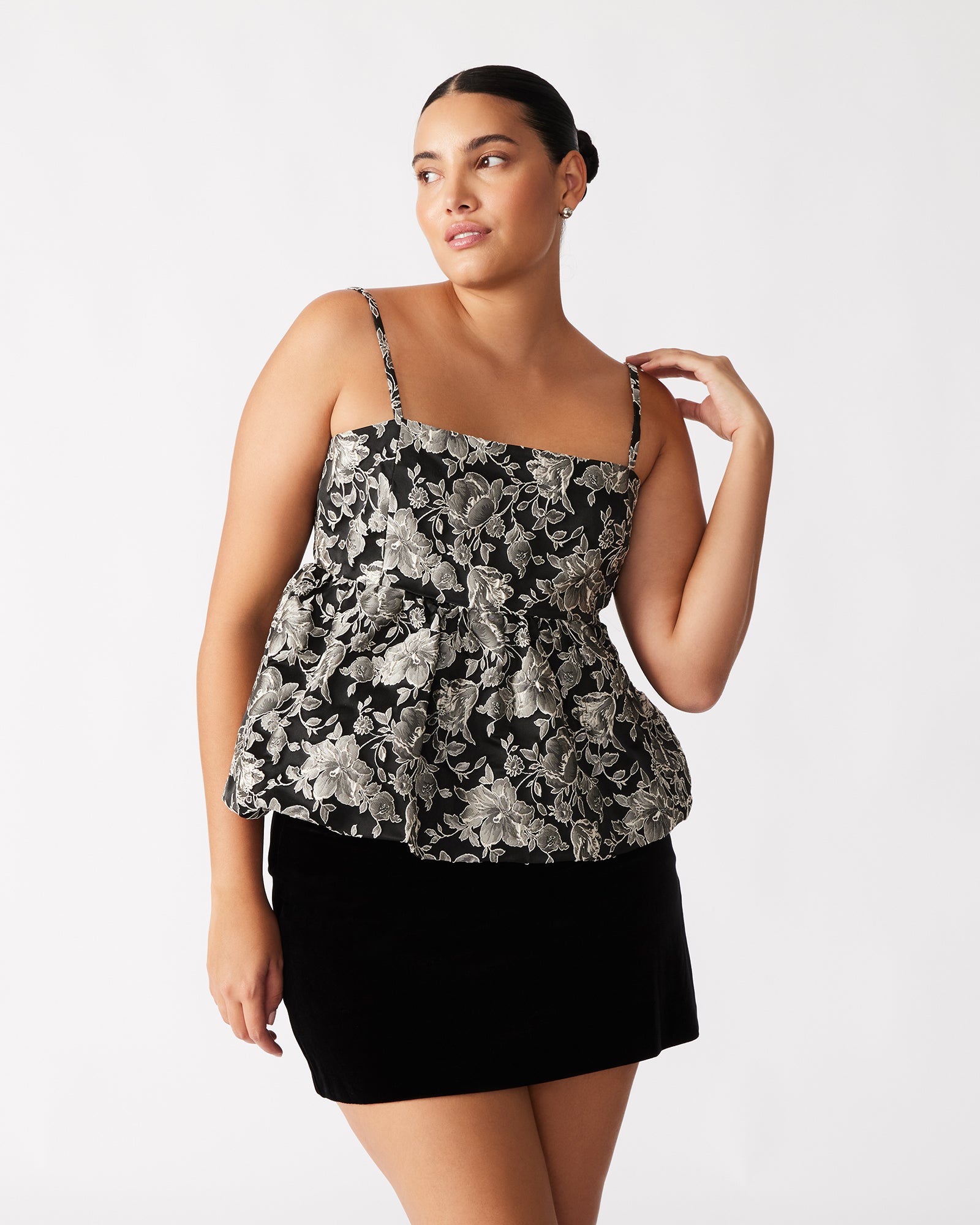 Side view of the floral print top, highlighting its lightweight fabric and stylish design.