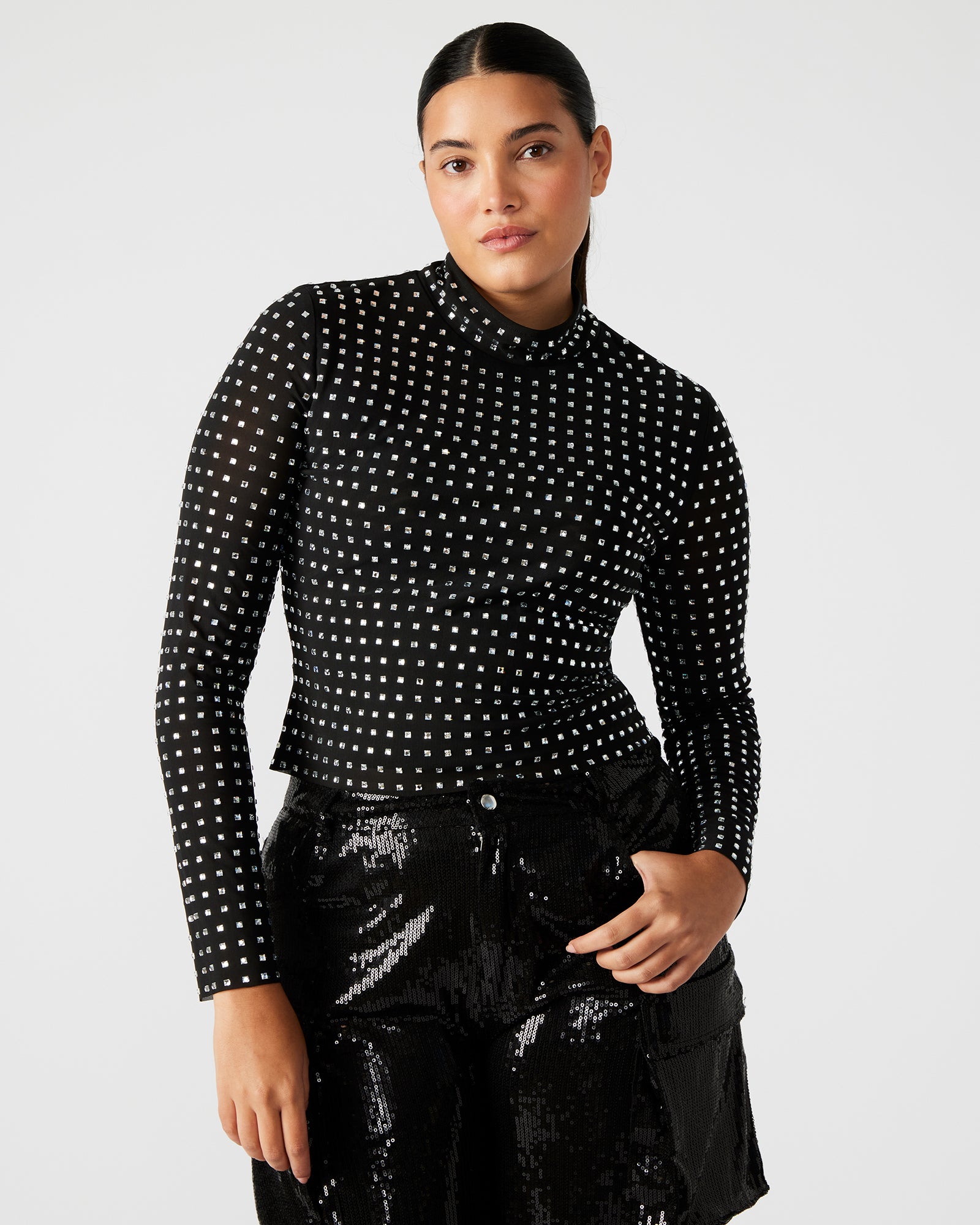Front view of the Melvina black mock neck top showcasing rhinestone details.