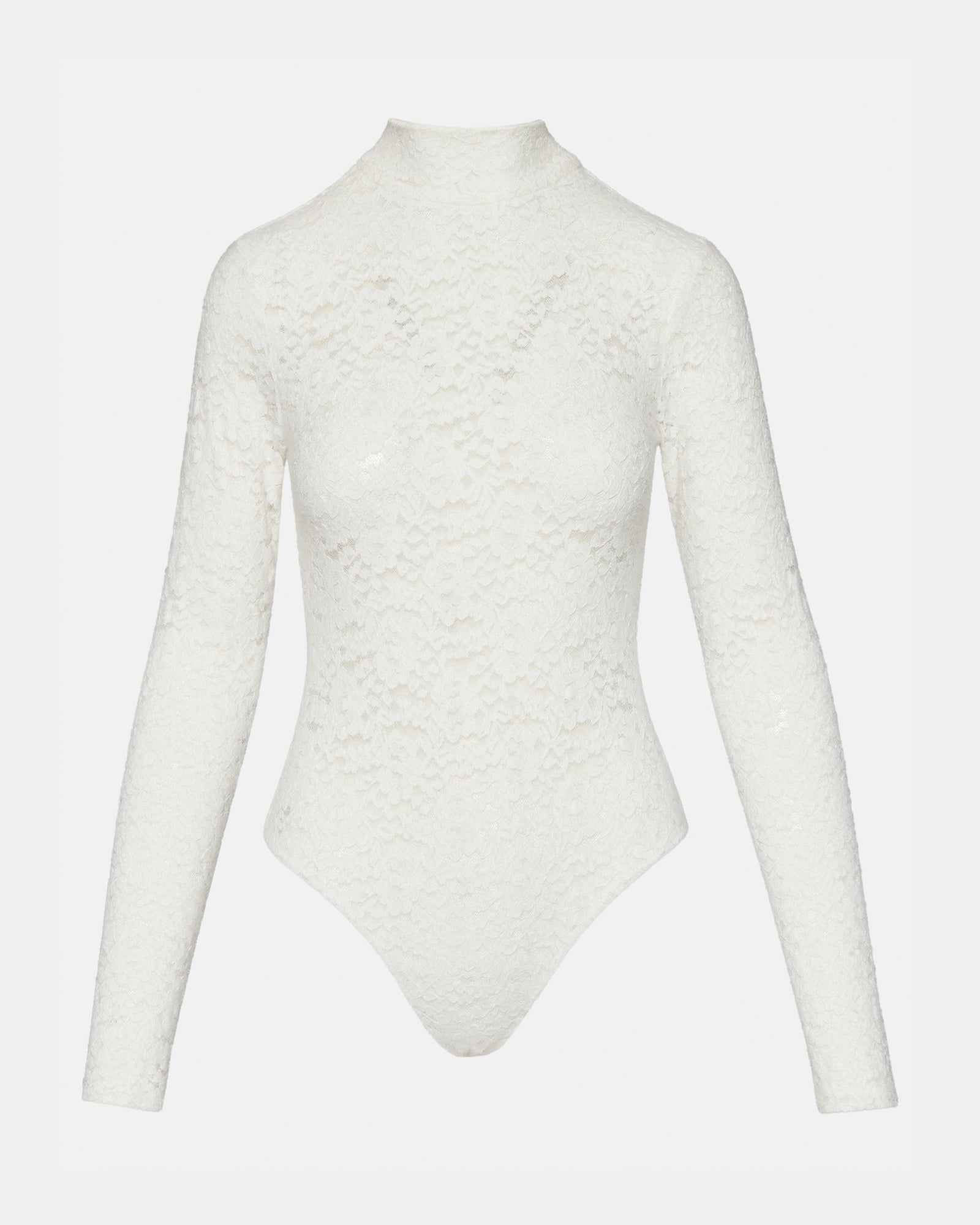 Front view of ivory sheer bodysuit with lace sleeves worn by model in a city setting.