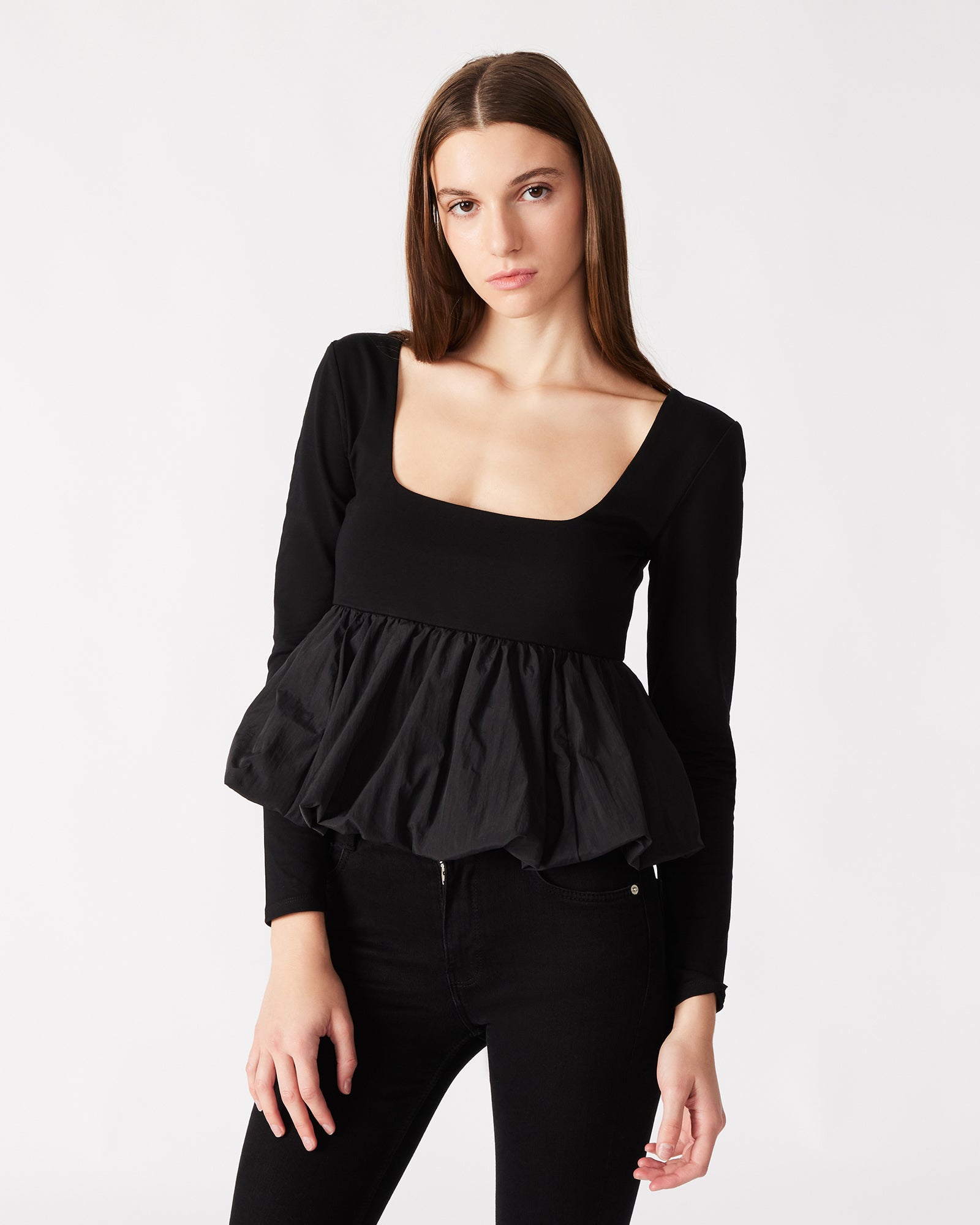 Close-up of the back zip closure on the womens peplum top