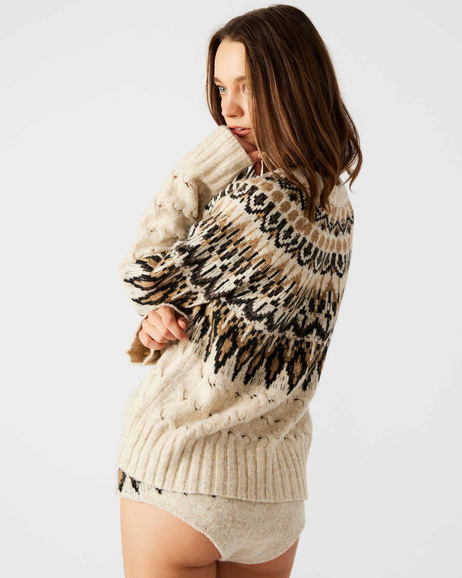 Model wearing the matching sweater set, perfect for a chilly day out.