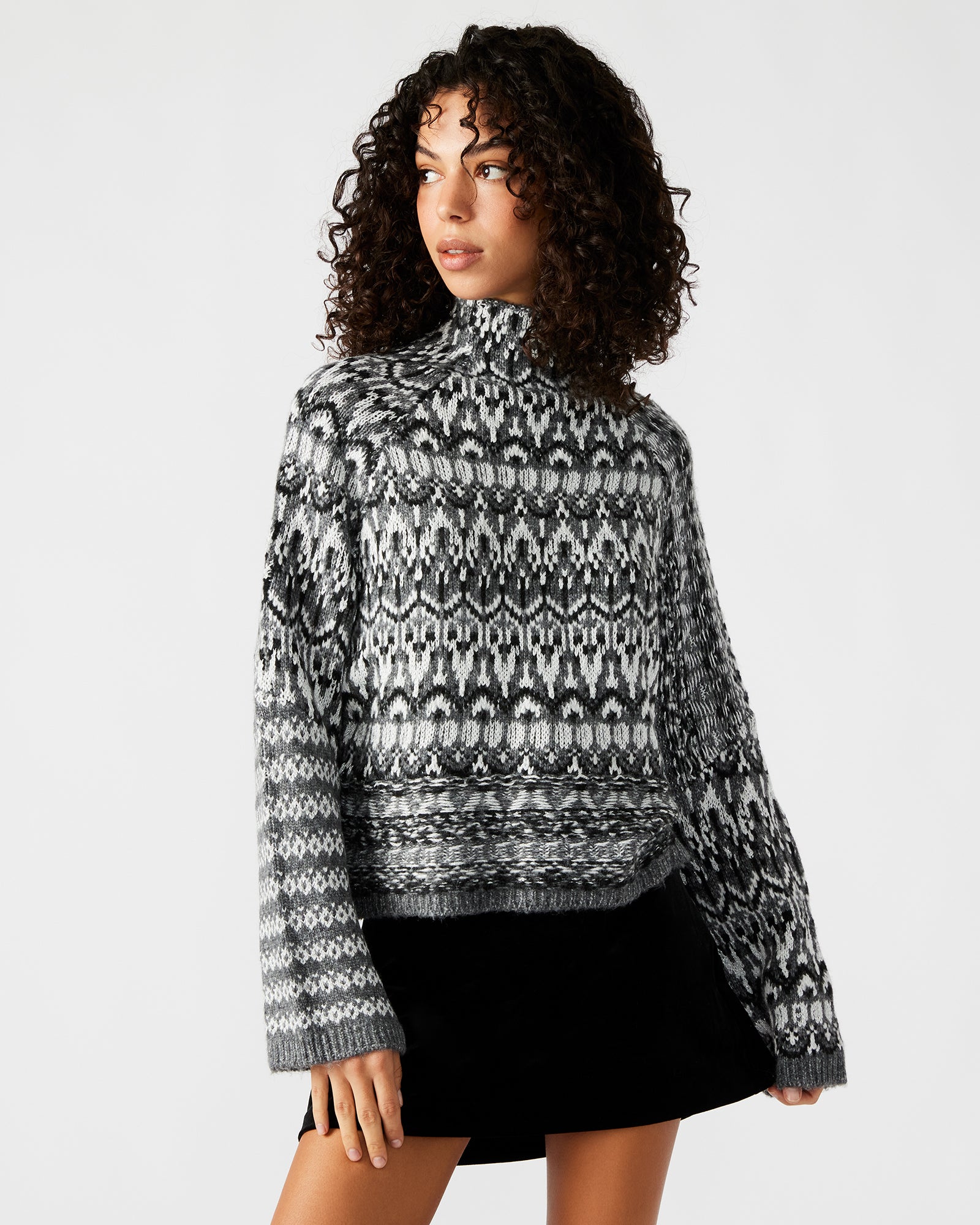 Front view of the charcoal Fair Isle turtleneck sweater showcasing its stylish design