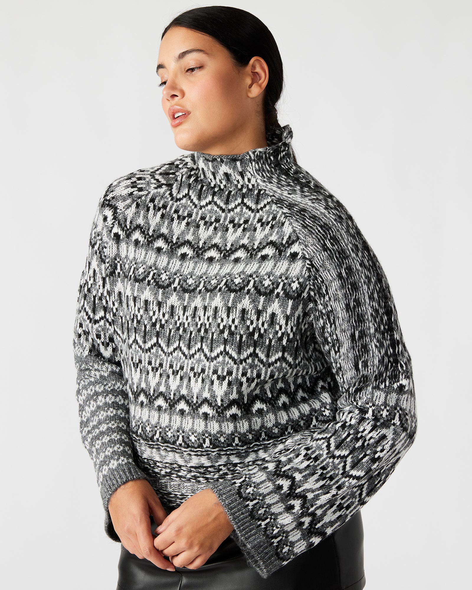 Side view of the Fair Isle sweater highlighting the cozy long sleeves