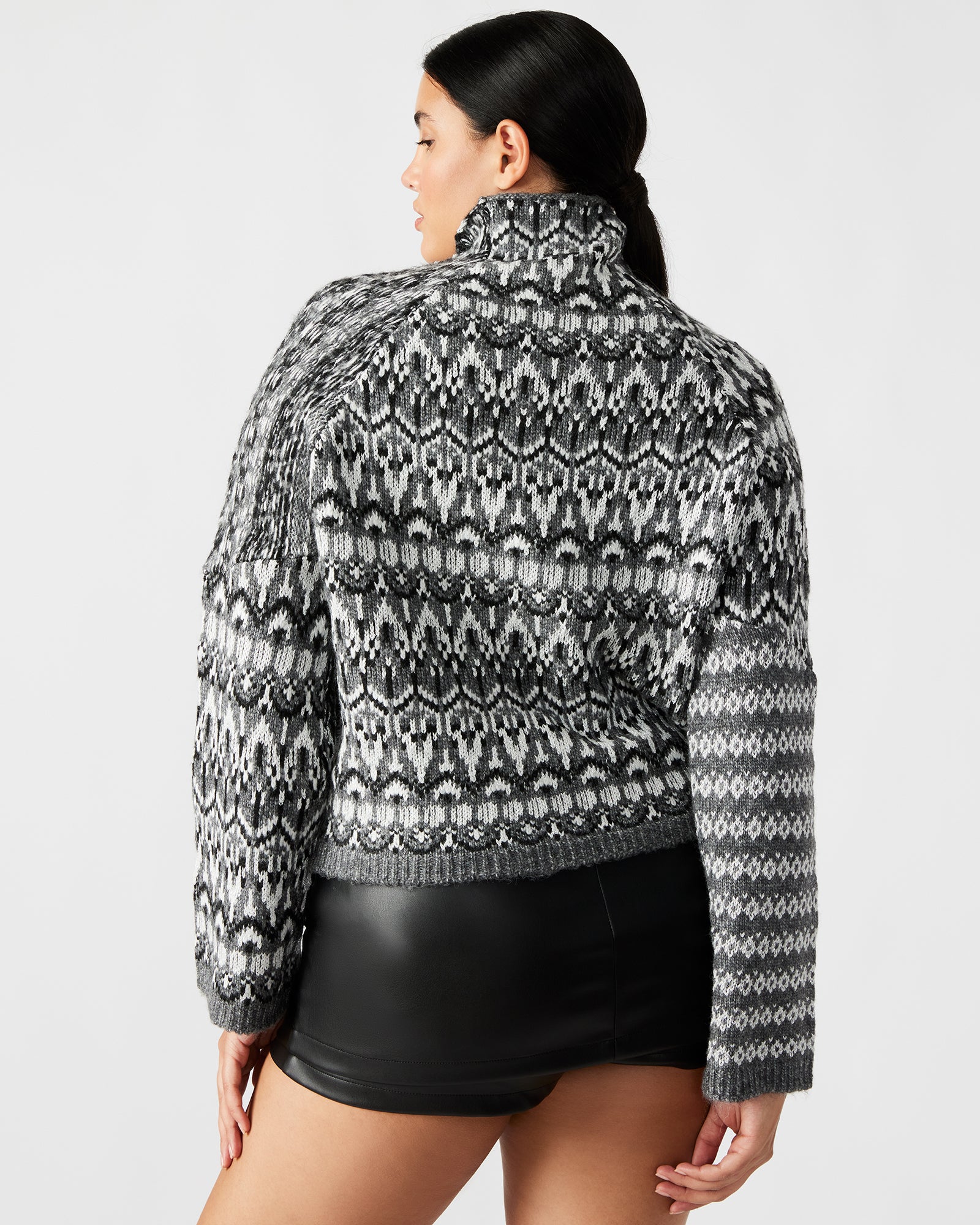 Side view of the Fair Isle sweater highlighting the cozy long sleeves