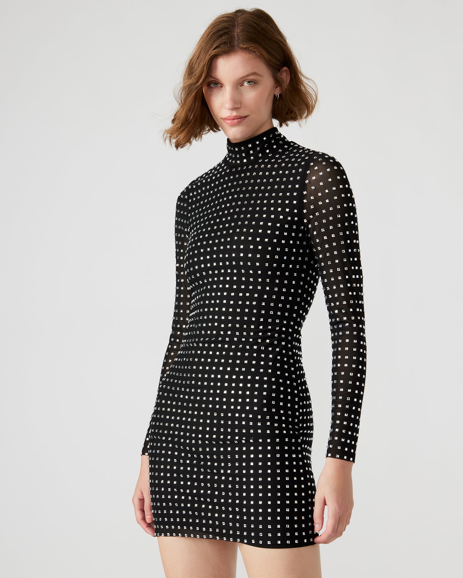 Side view of Krista black cocktail dress highlighting the mock neck.