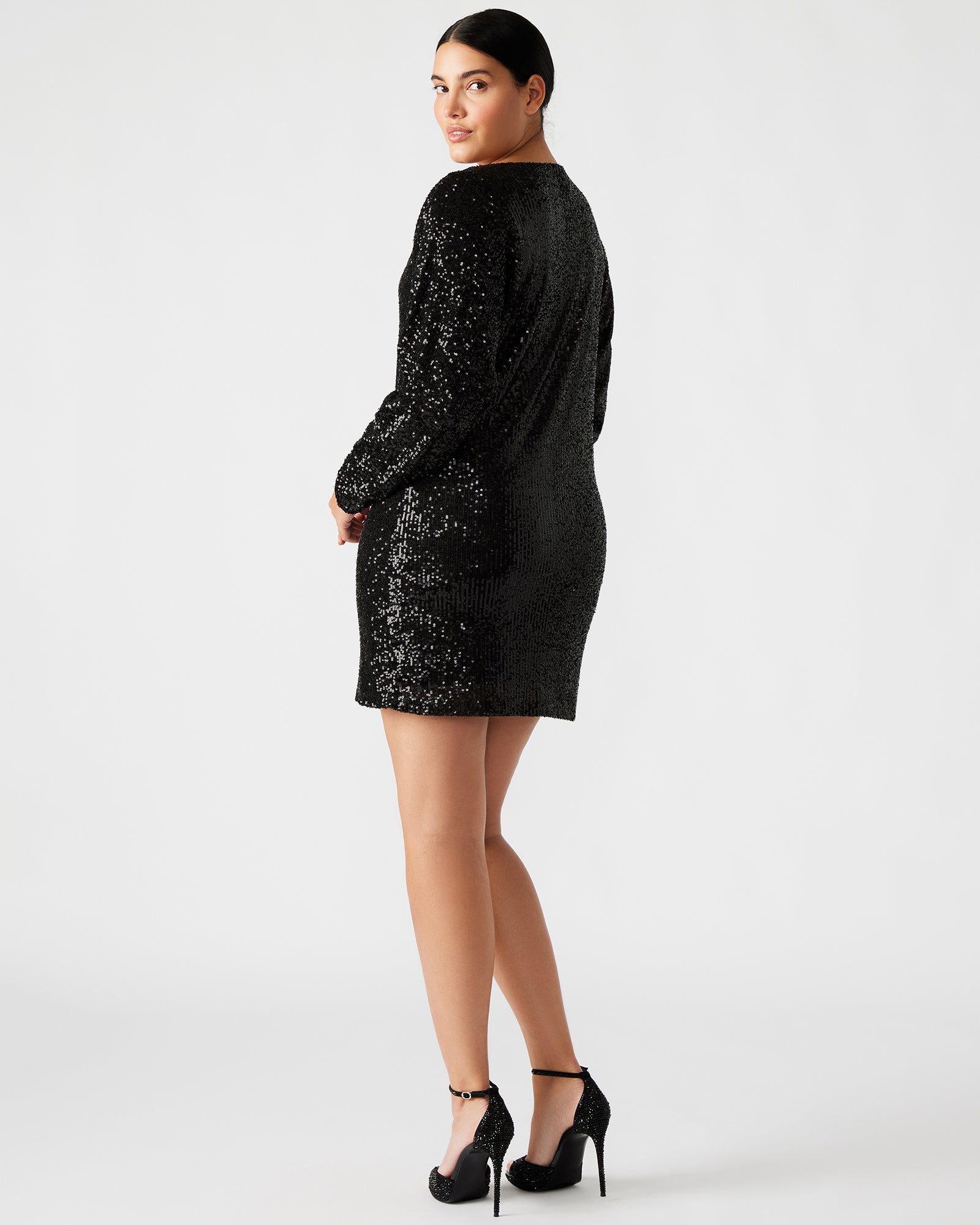 Close-up of the black sequin mini dress showcasing shimmering details