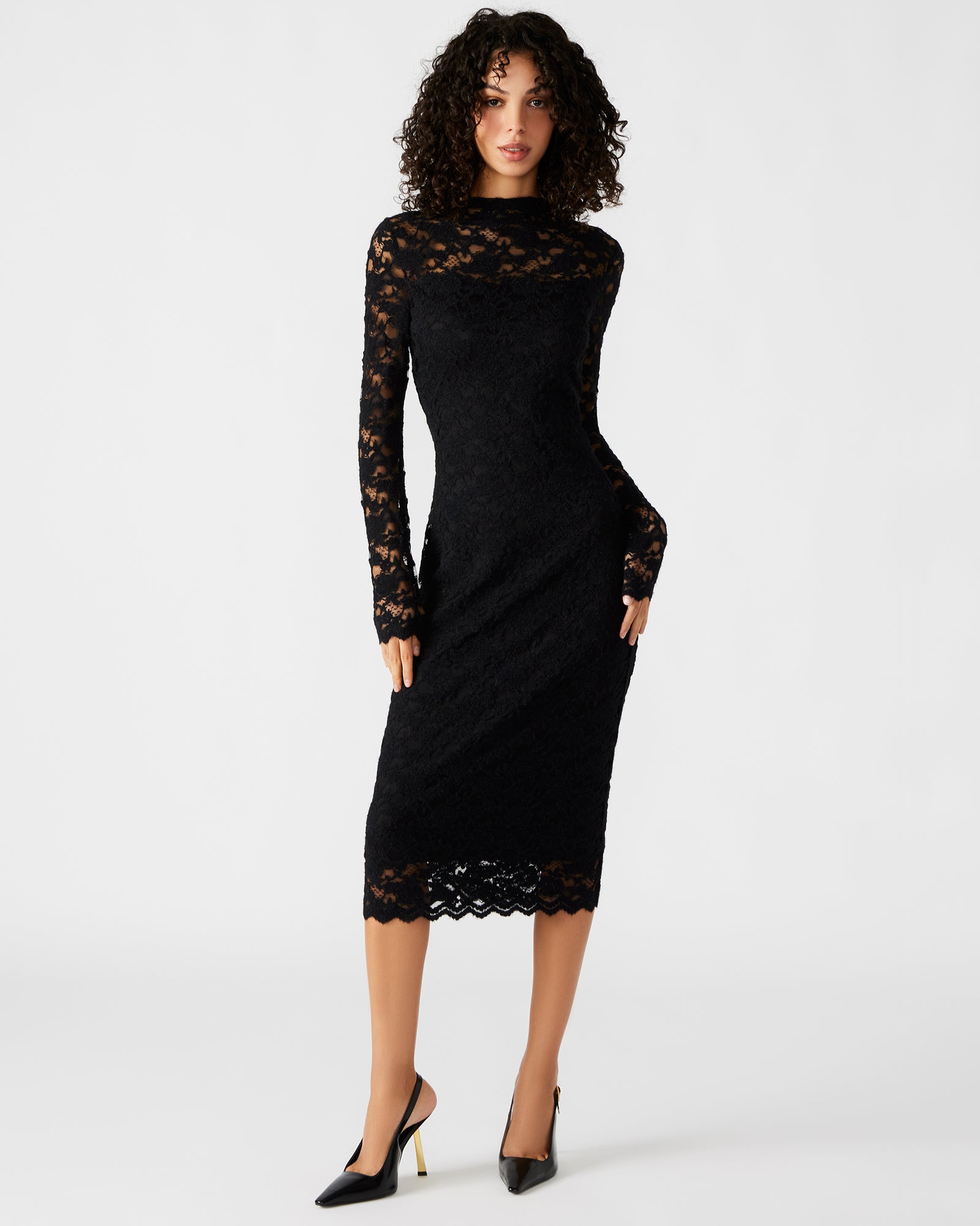 Front view of black mini dress with sheer mesh sleeves styled for an evening event