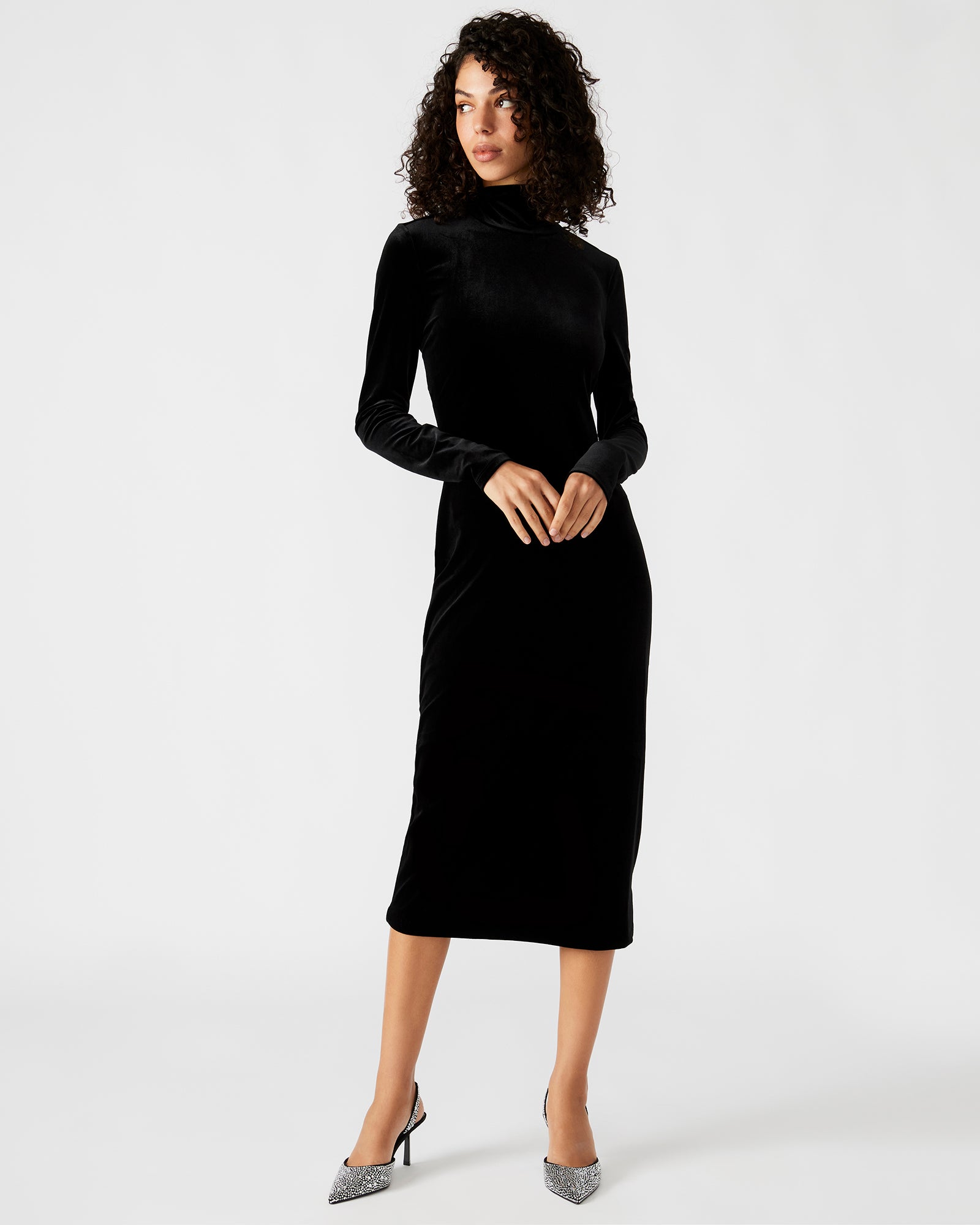 Front view of the Skyler black velvet dress showcasing the turtleneck and long sleeves.