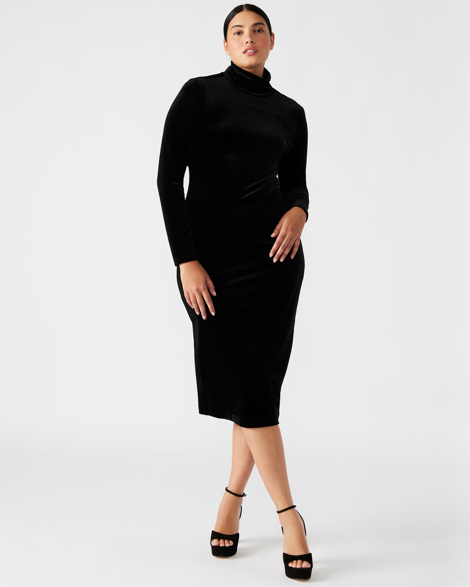 Front view of the Skyler black velvet dress showcasing the turtleneck and long sleeves.
