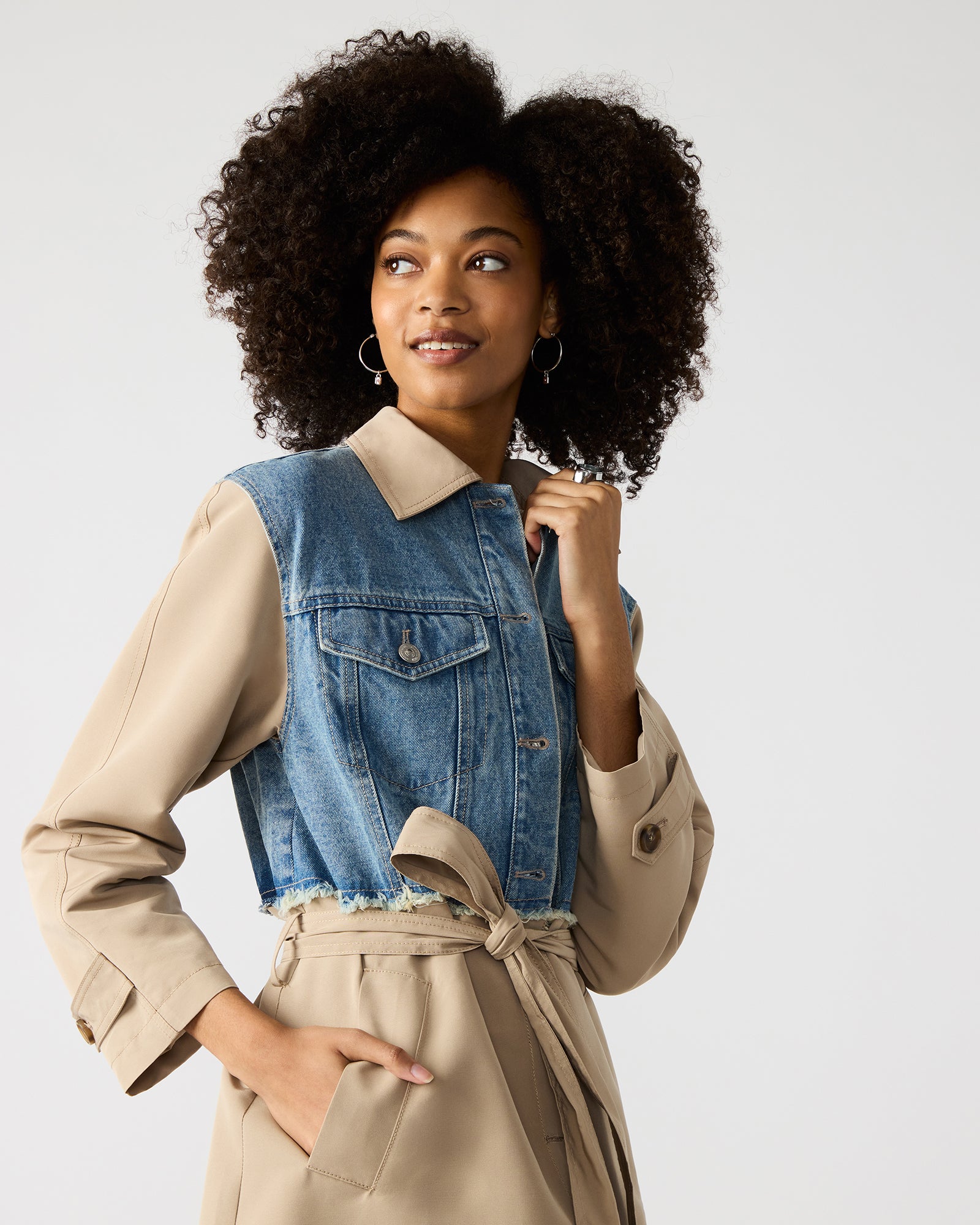 Model walking through Manhattan in denim chore coat with vintage structure.