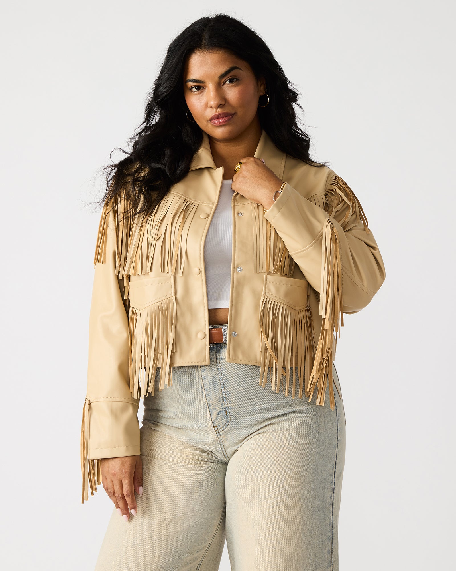 Close-up of snap-button closure and collar detail on faux leather jacket.