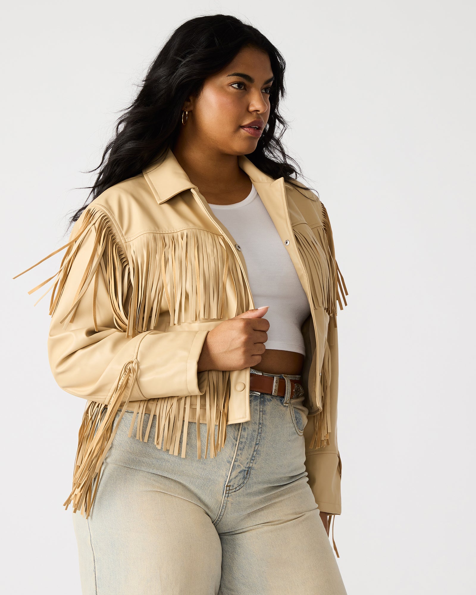 Back view showcasing long fringe flowing from shoulders on Western style sports jacket.