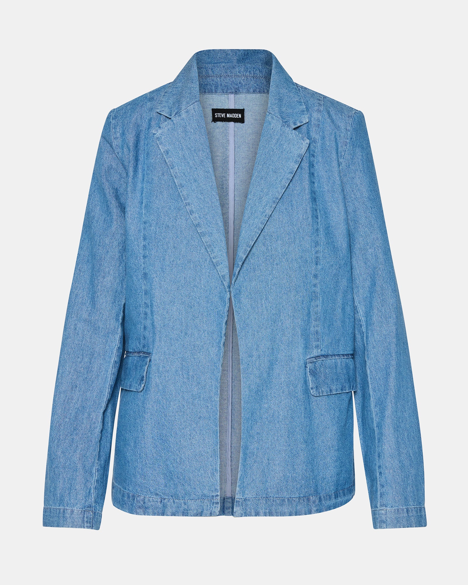Front view of denim blazer women styled over white tee and trousers