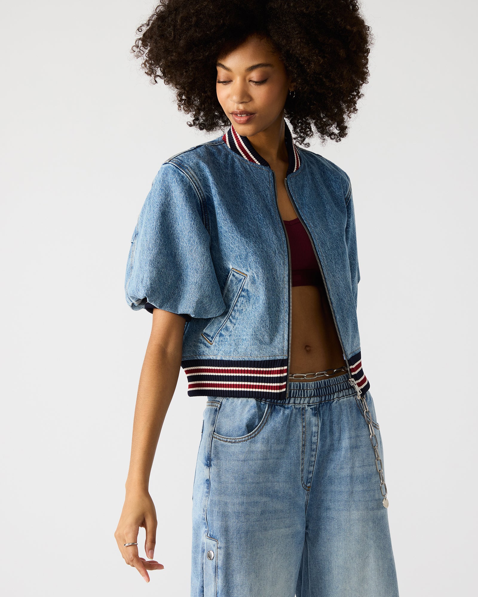 Lifestyle shot of oversized denim jacket styled for weekend brunch