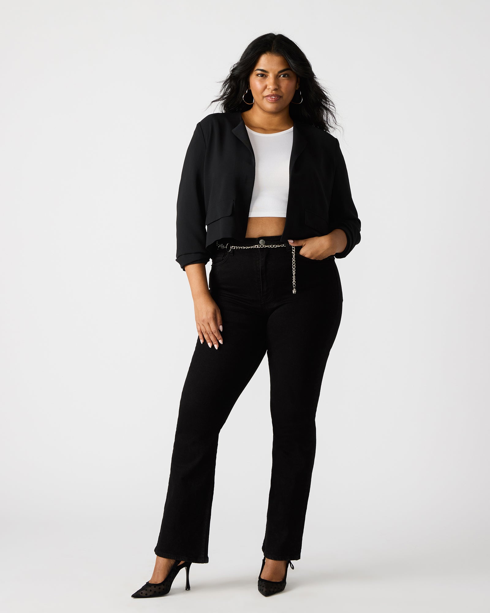 Side angle of the Serenea blazer worn casually with jeans.