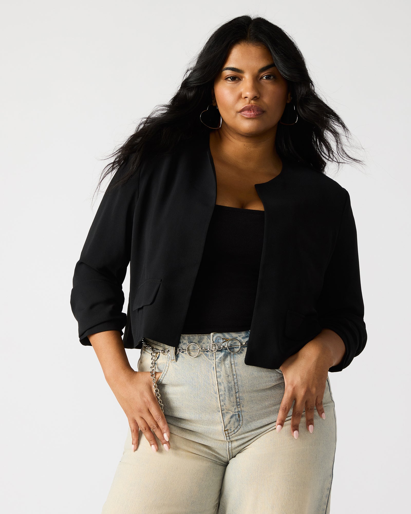 Front view of the women's black blazer showcasing its elegant design.