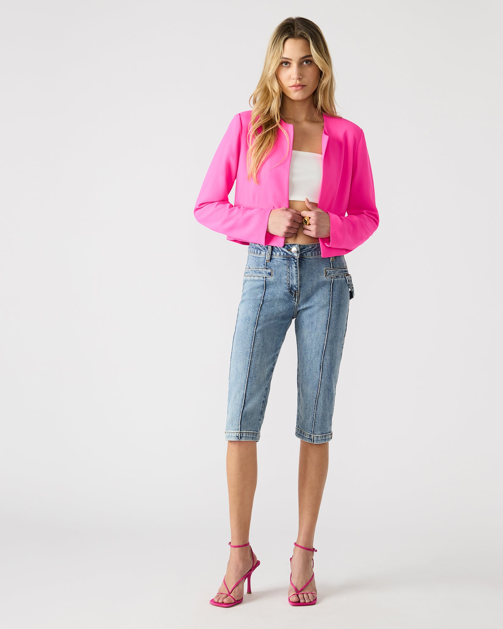 Model wearing the Serenea blazer with tailored trousers for a professional look