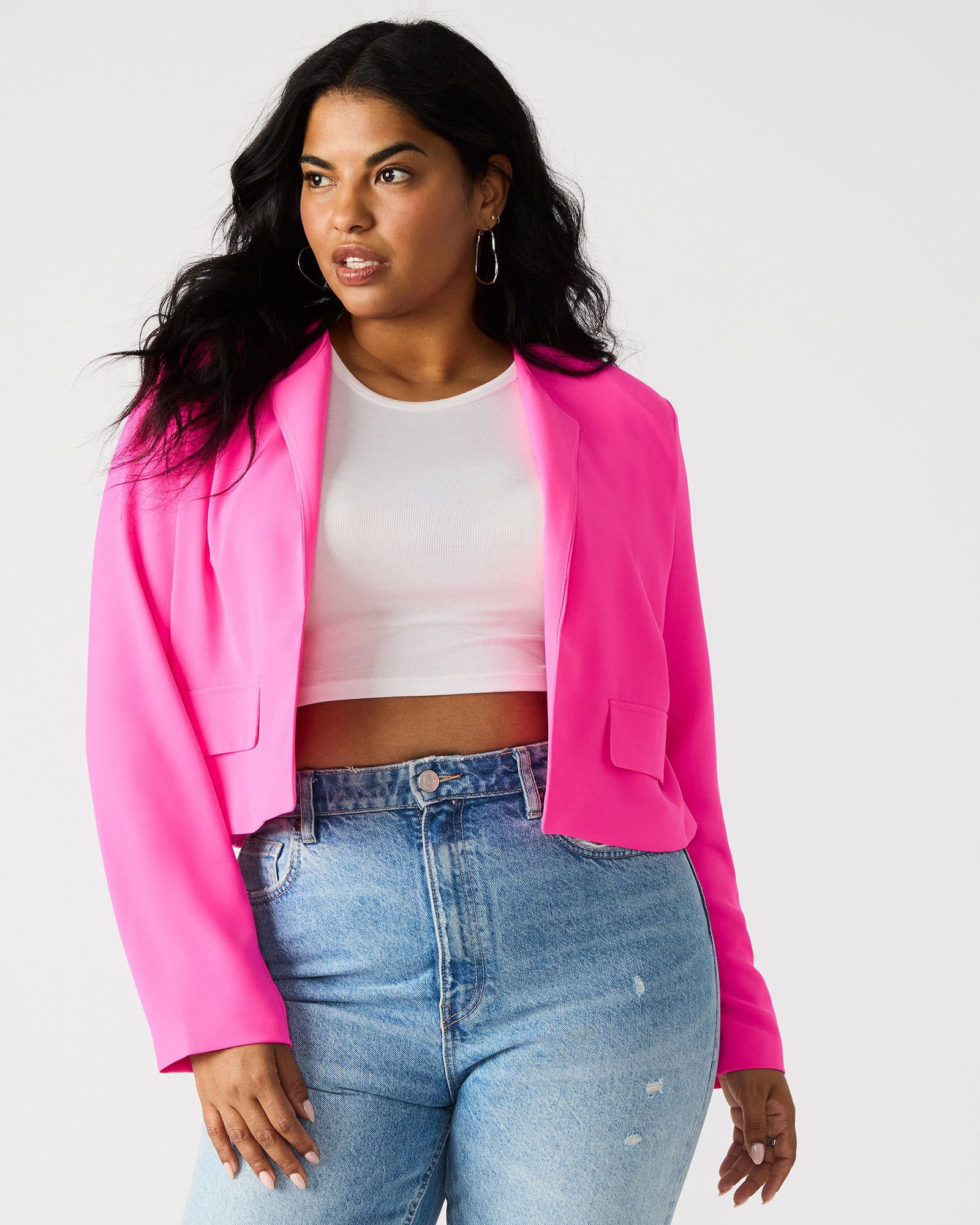 Close-up of the women's velvet blazer showing texture and hot pink hue