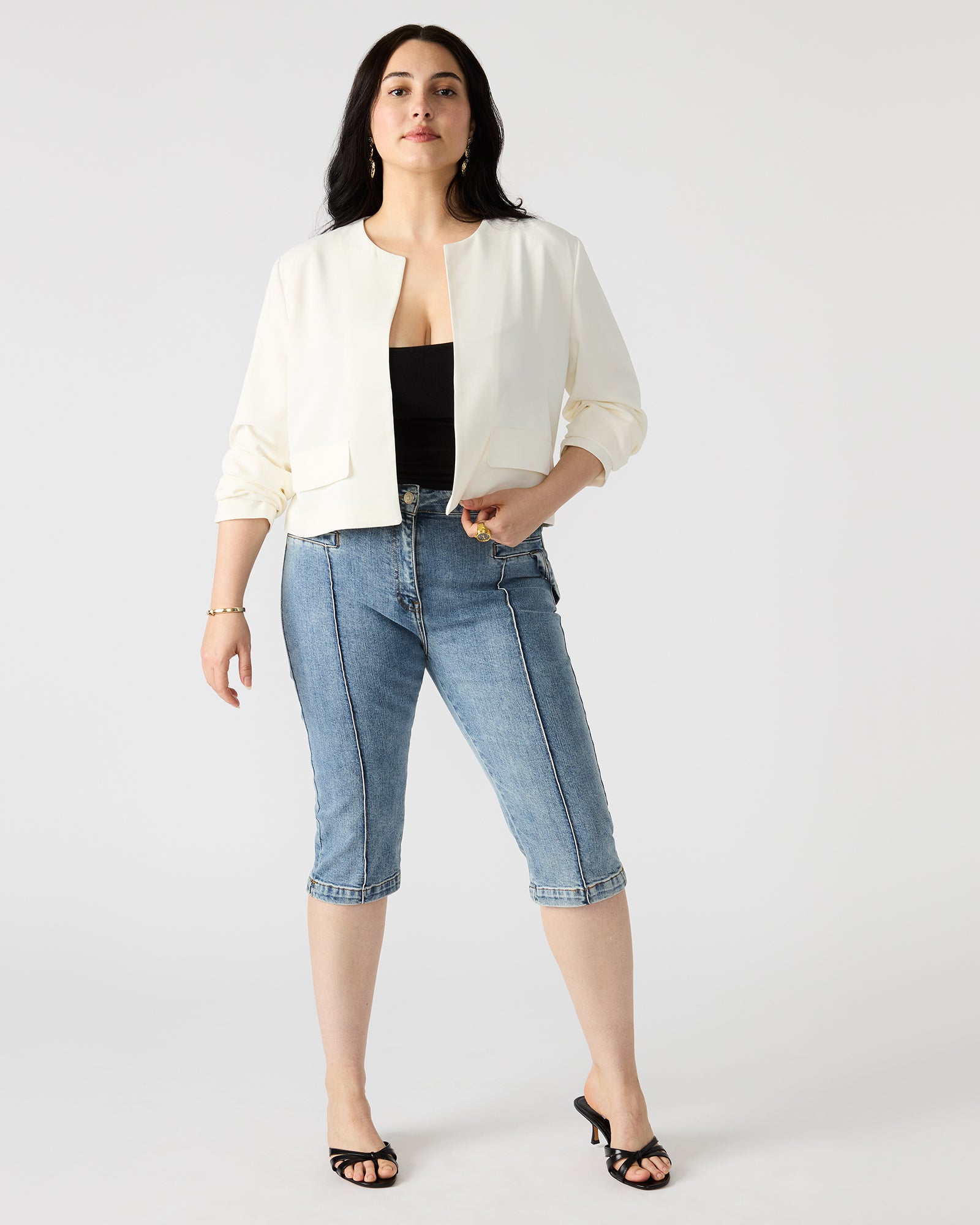 Front view of the white open front blazer showcasing its elegant design.