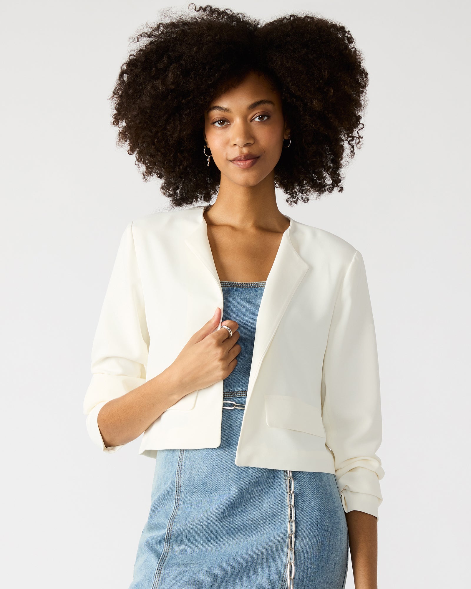 Front view of the white open front blazer showcasing its elegant design.