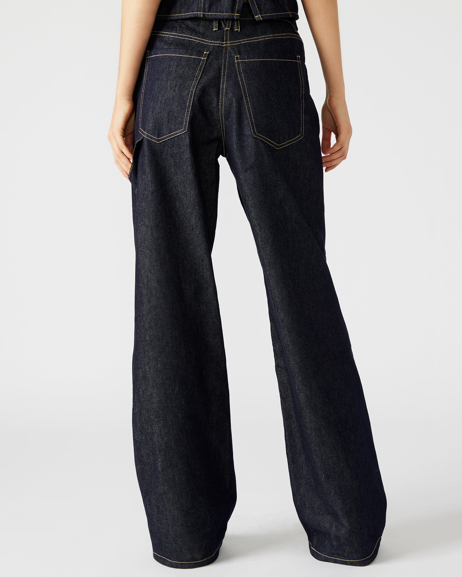 Back view of stylish wide leg jeans highlighting the relaxed fit.