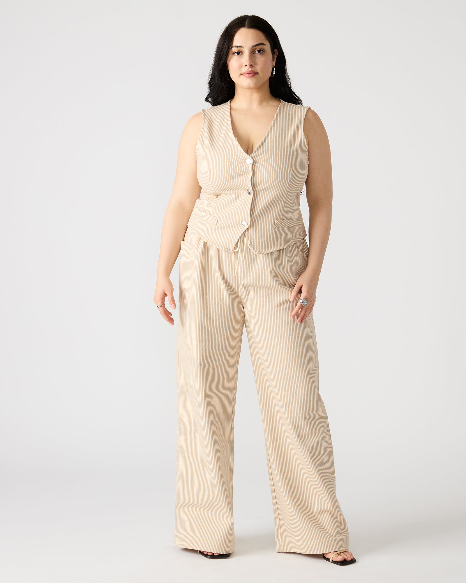 Side angle of wide leg linen pants worn during a casual stroll