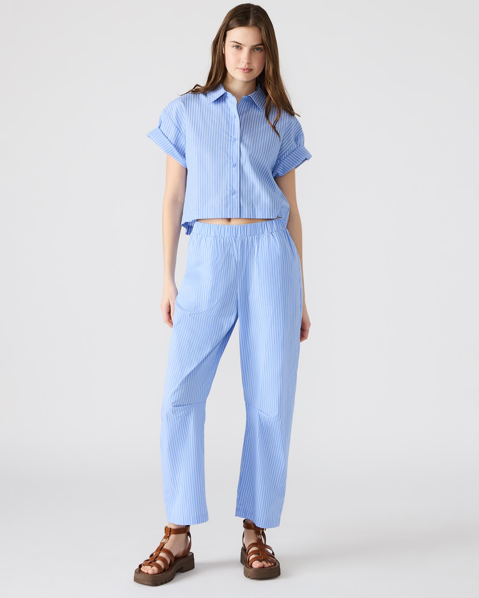 Pinstripe women's trousers styled with a casual top