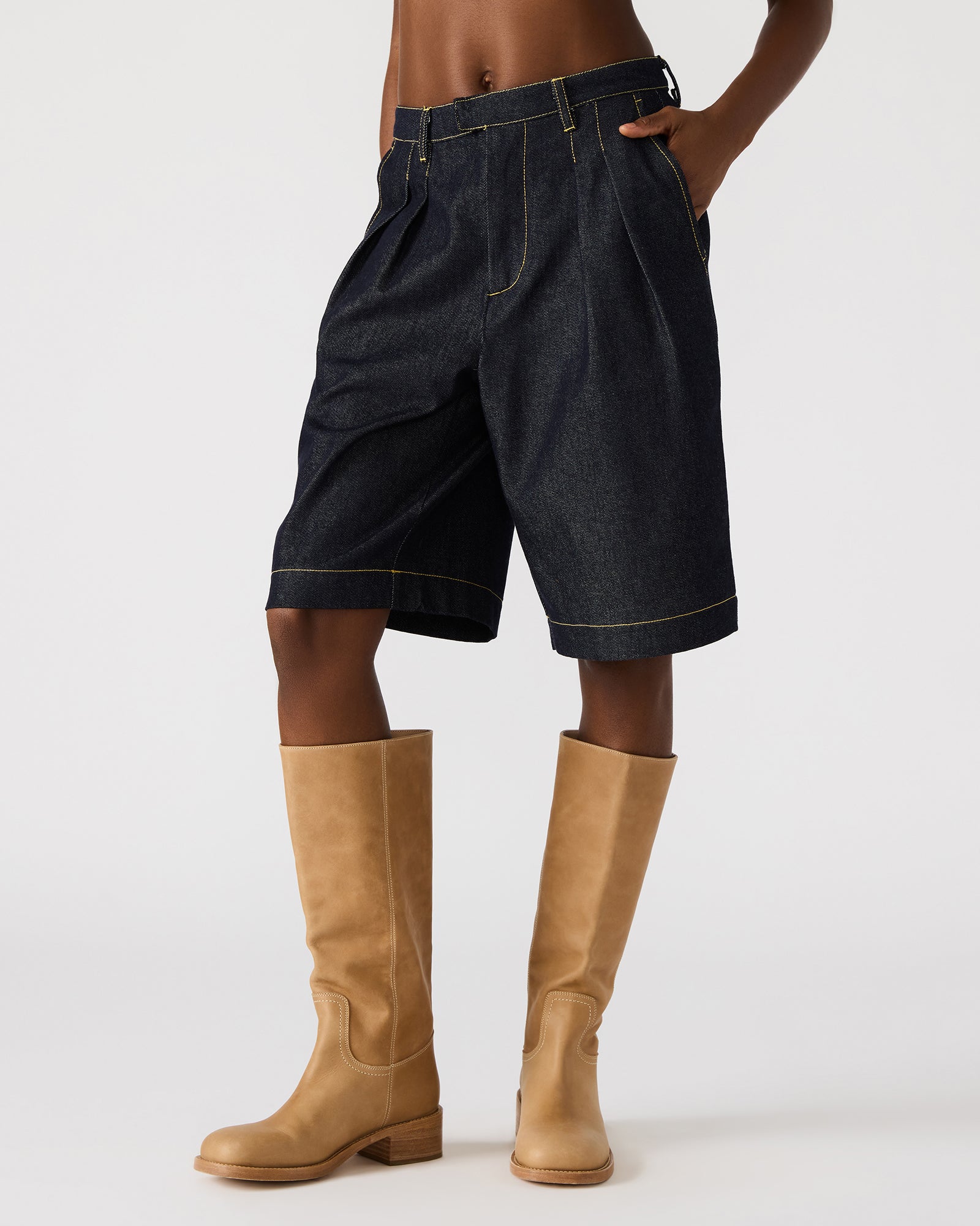 Close-up of Ivana denim shorts showcasing the front pockets and zipper detail.