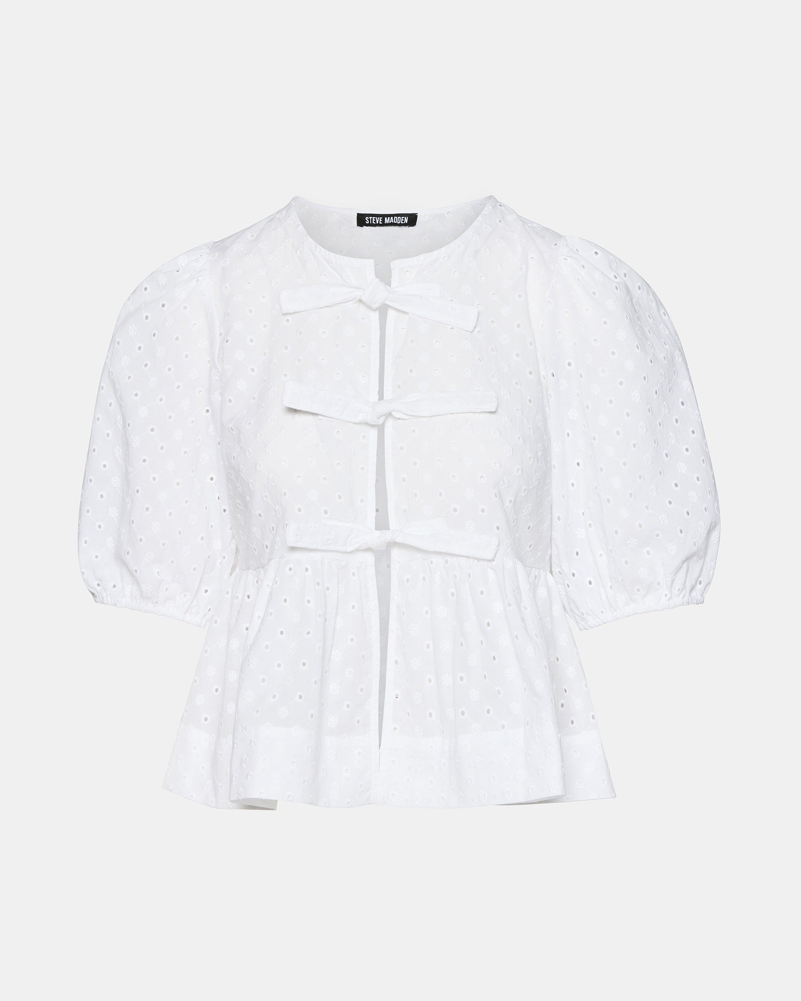 Front view of the chic white puff sleeve crop top showcasing its tie-front design and eyelet detailing.