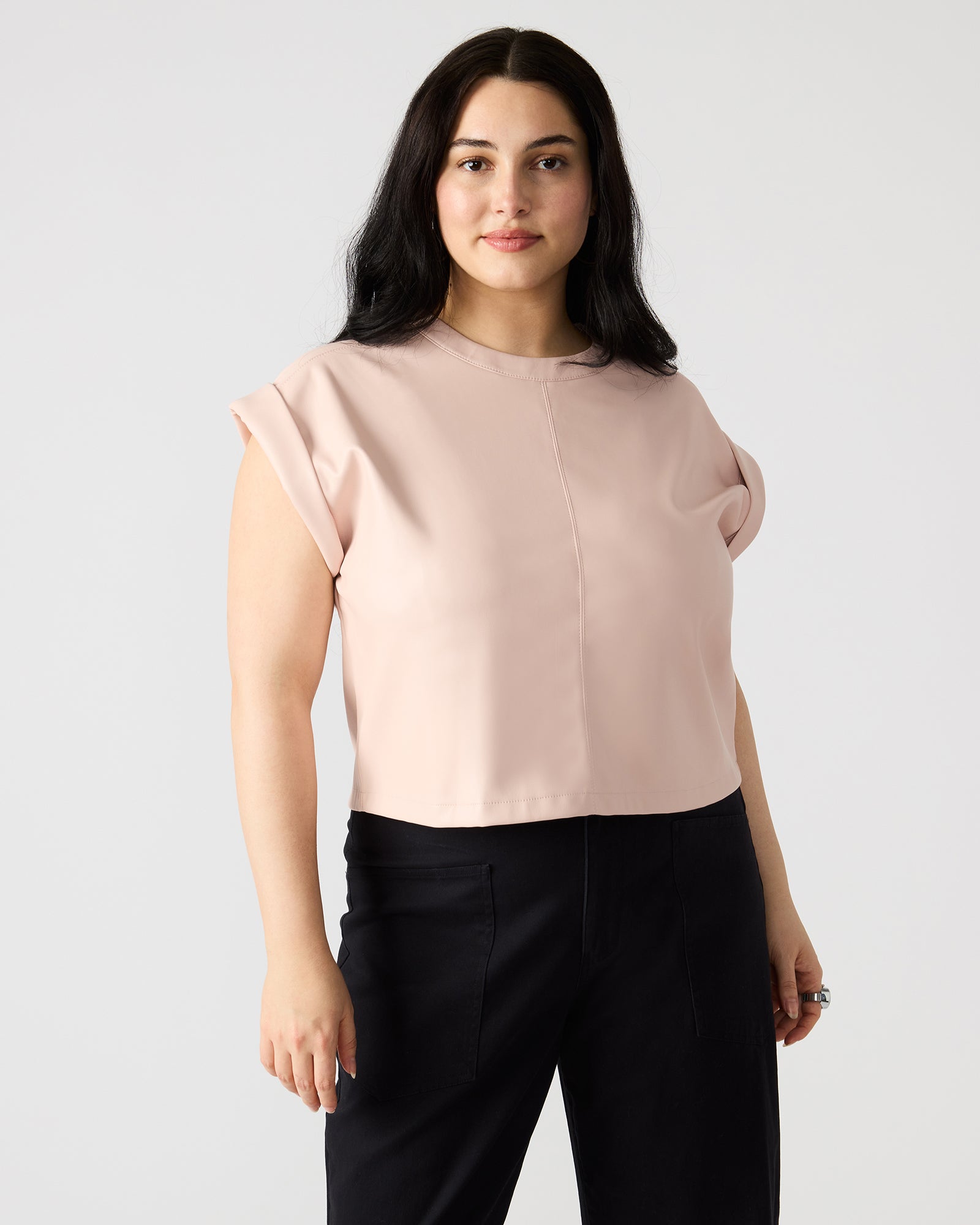 Close-up of the back zipper detail on faux leather top
