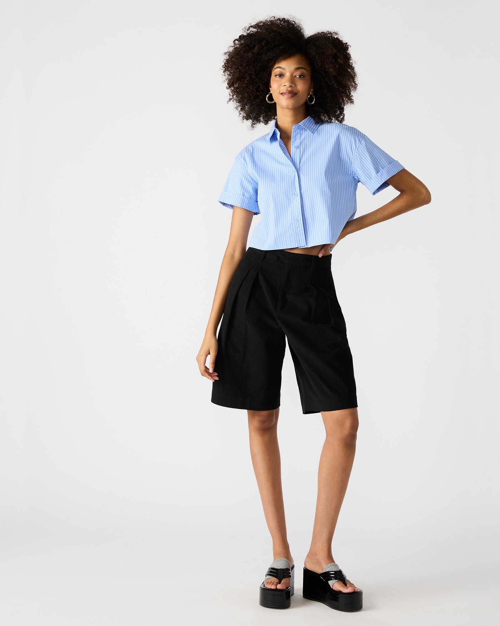 Close-up of the collared neckline and button-up detail