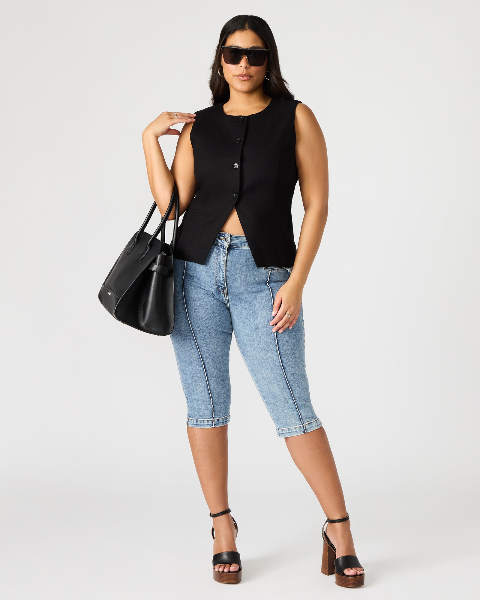 Close-up of Wesley black vest top with button details