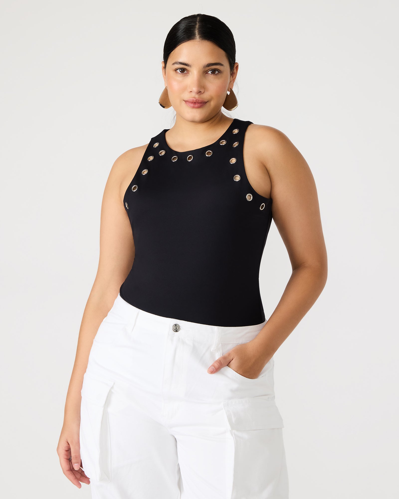 Nico black bodysuit worn with high-waisted trousers for a polished look.