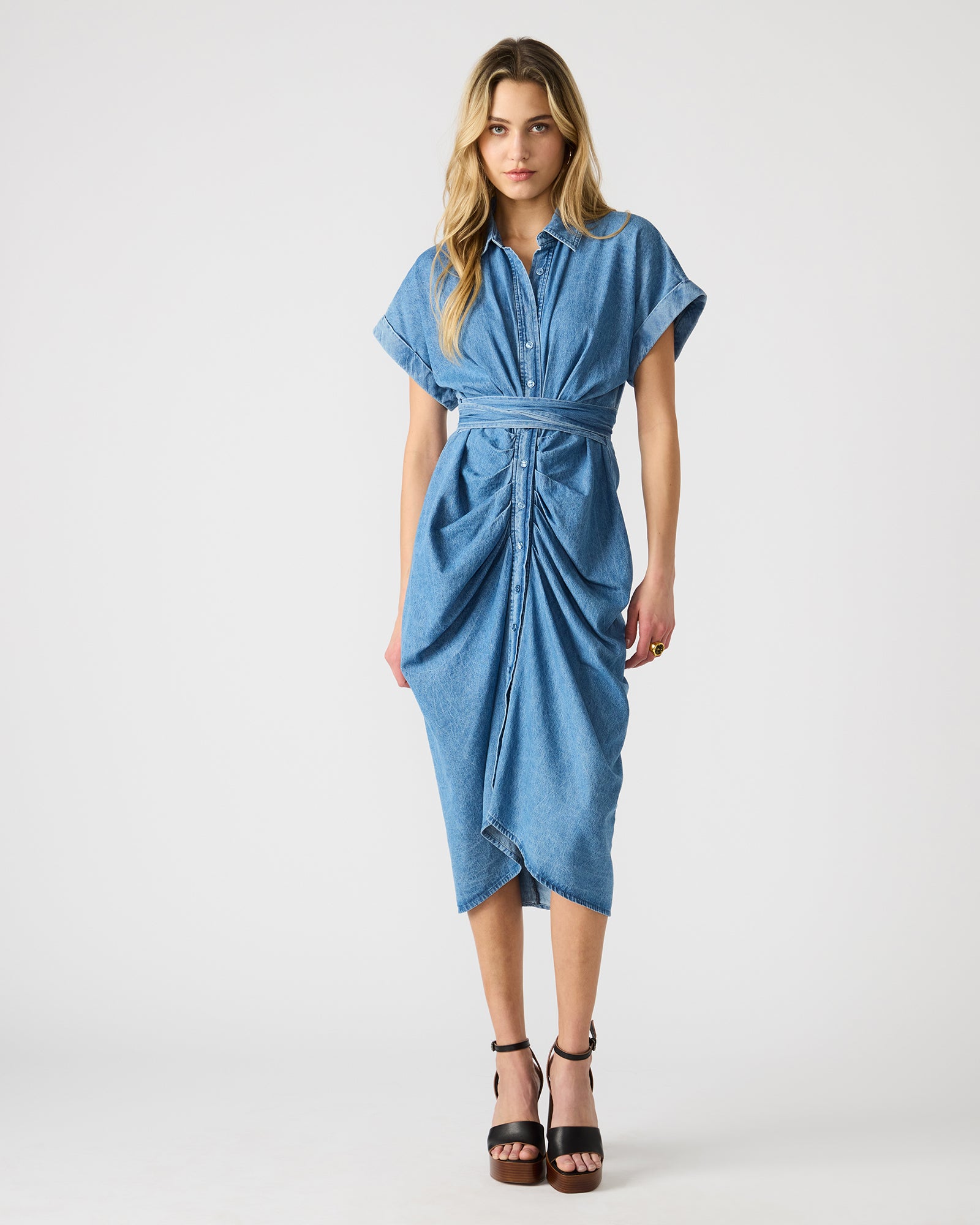 Back angle of tie-front dress showing adjustable fit and high-low hem