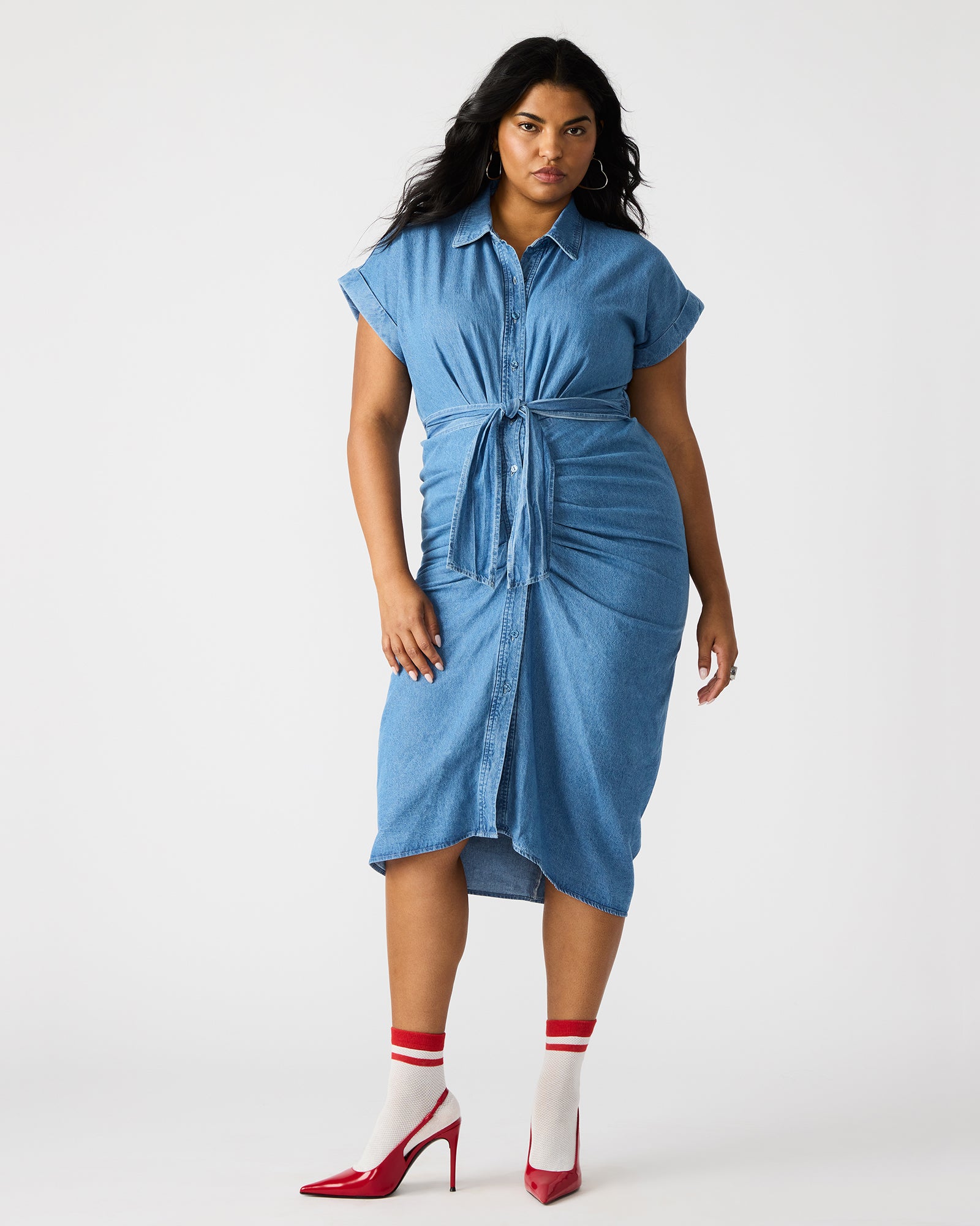 Front view of denim dress styled with flats, ideal for daily city wear