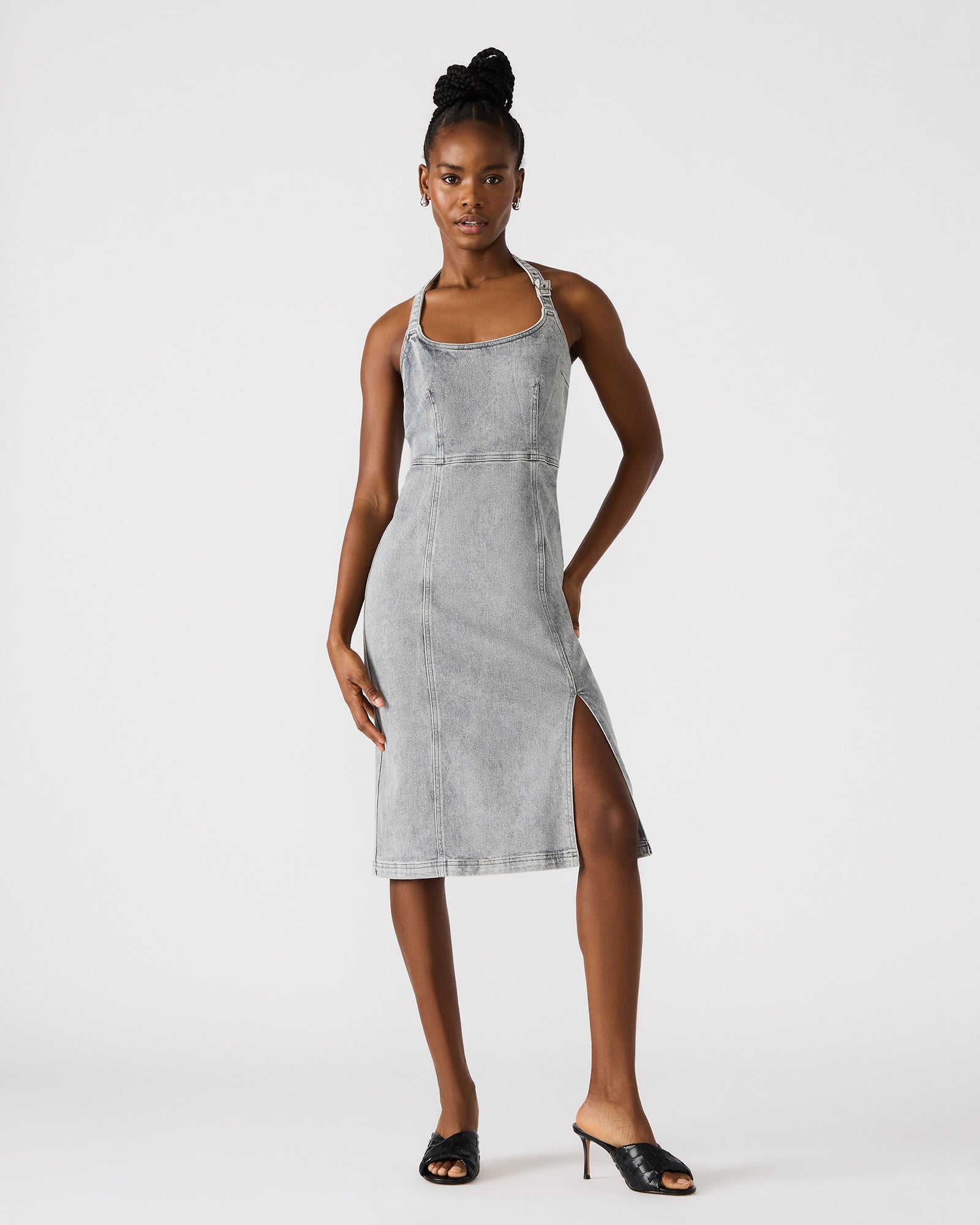 Close-up of the dresss side slit and textured denim fabric