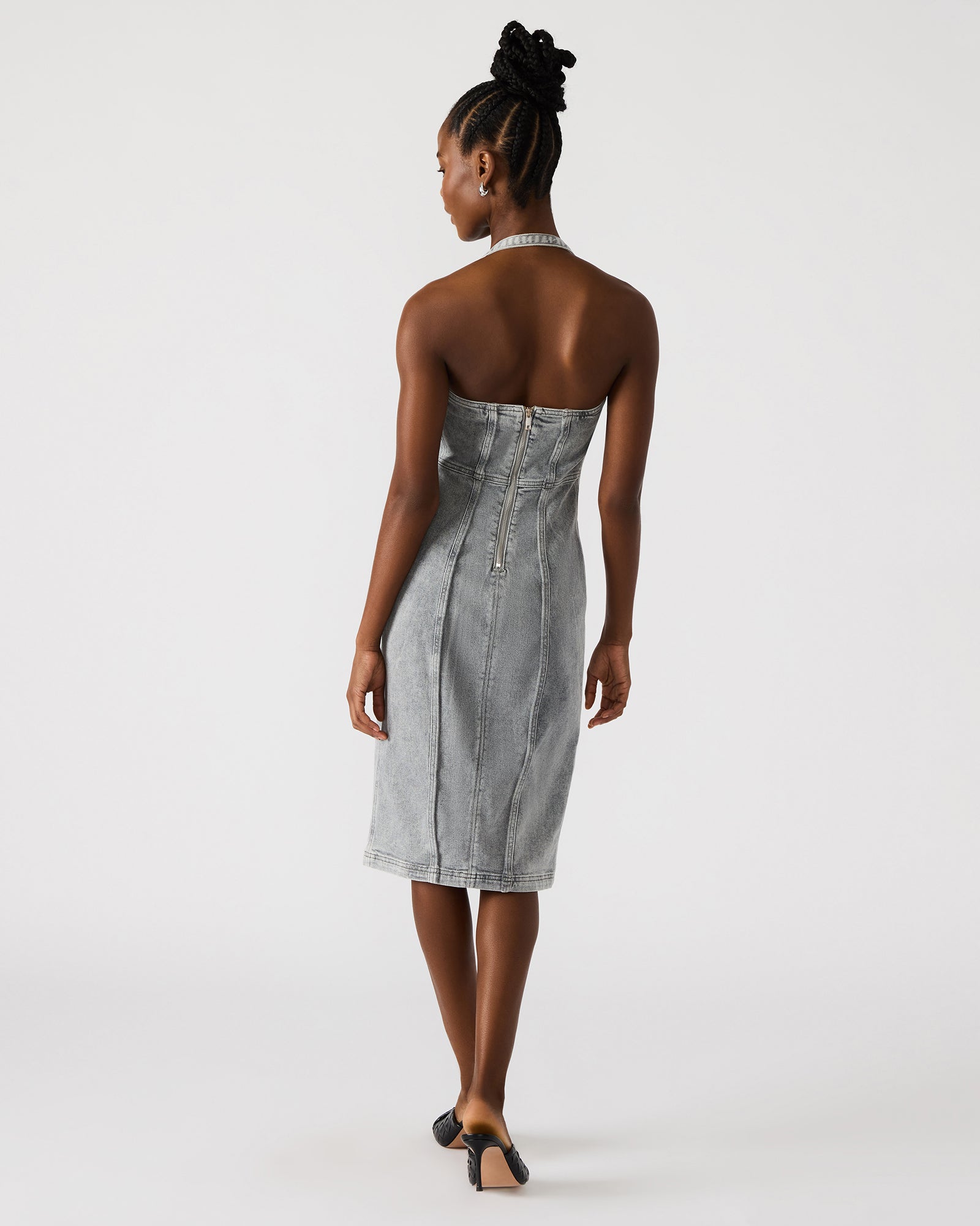 Back zipper detail of the fitted denim dress