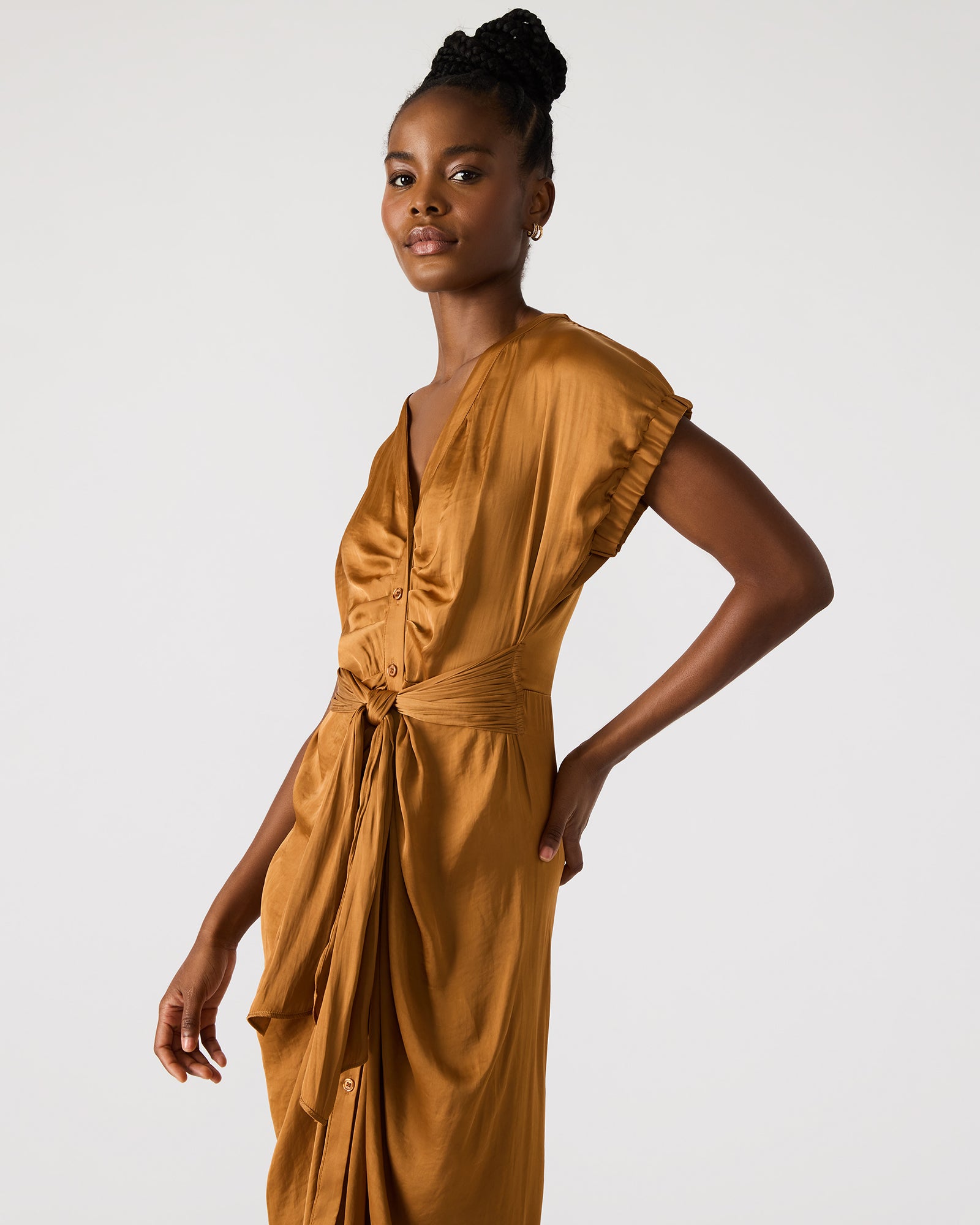 Model wearing the Bruno midi dress with button-up closure, styled for a casual outing