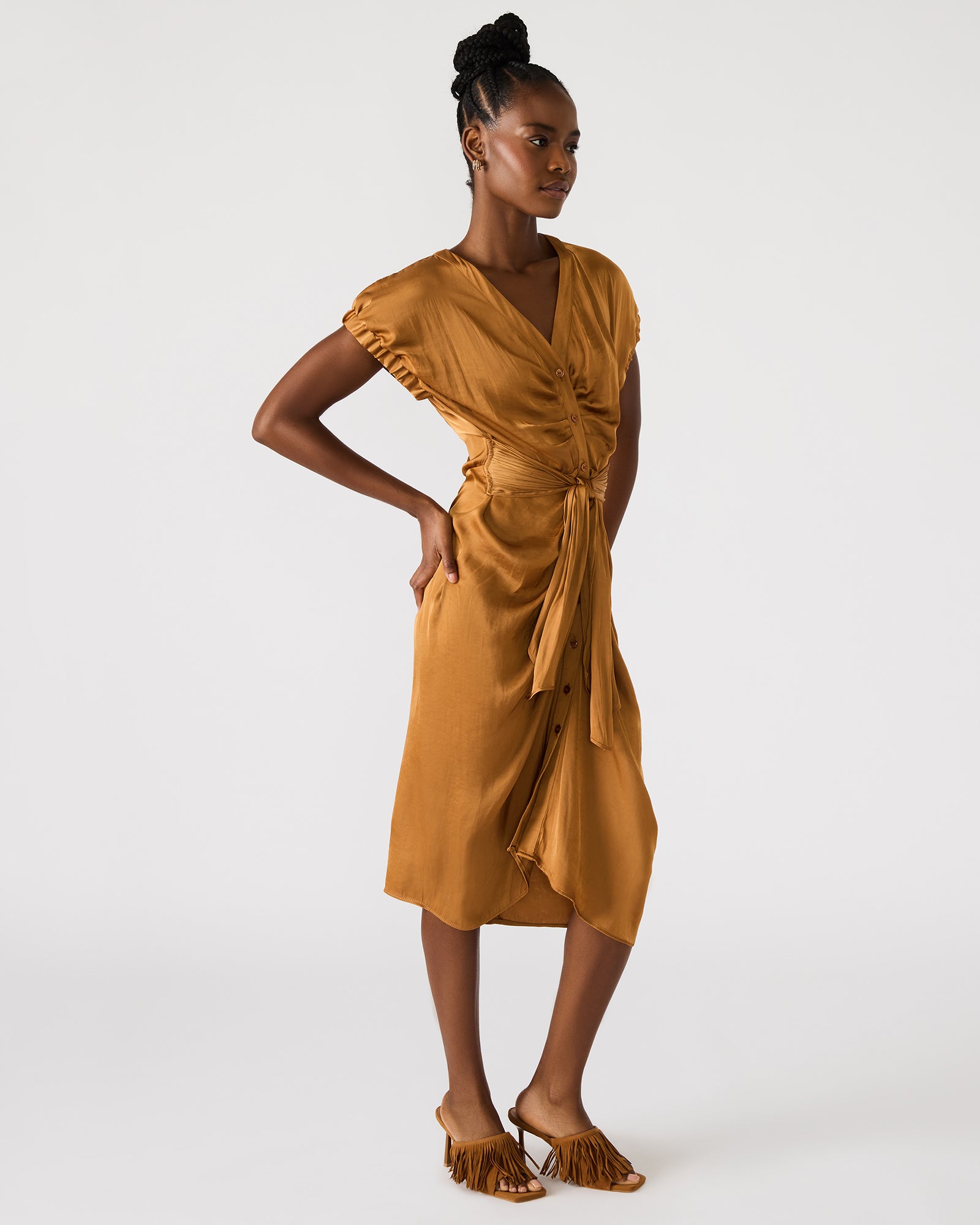 Close-up of the tie-front waist and button details on the Bruno caramel midi dress