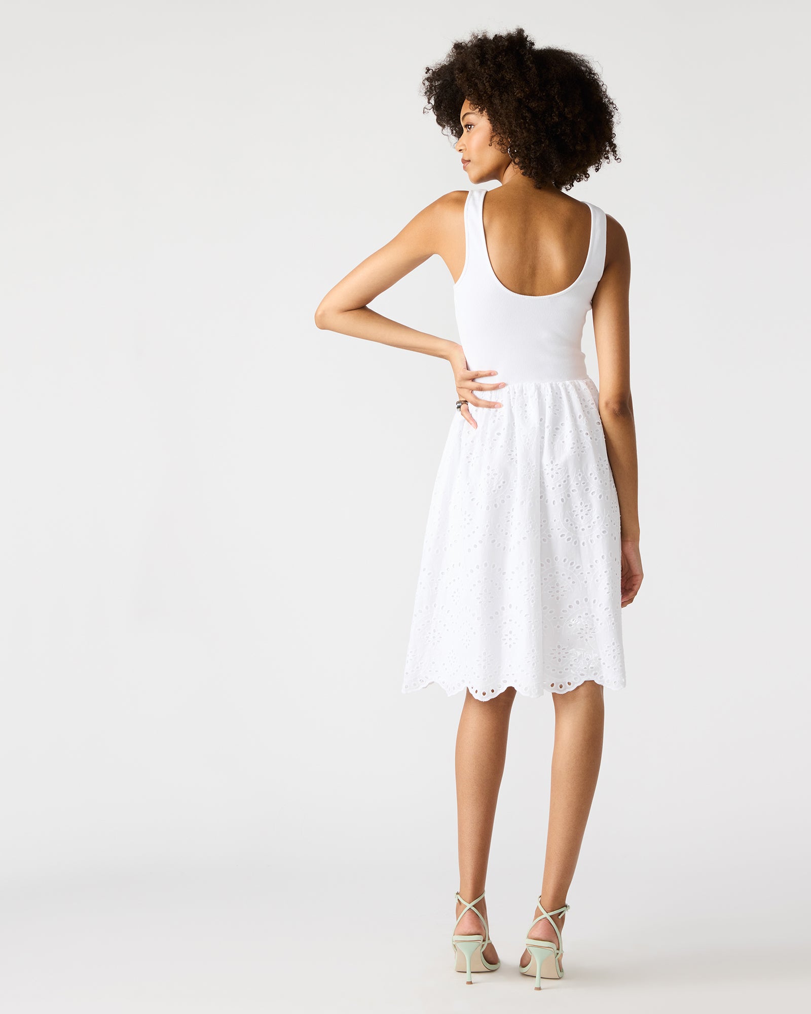 Model wearing black sleeveless dress version of Julian dress.