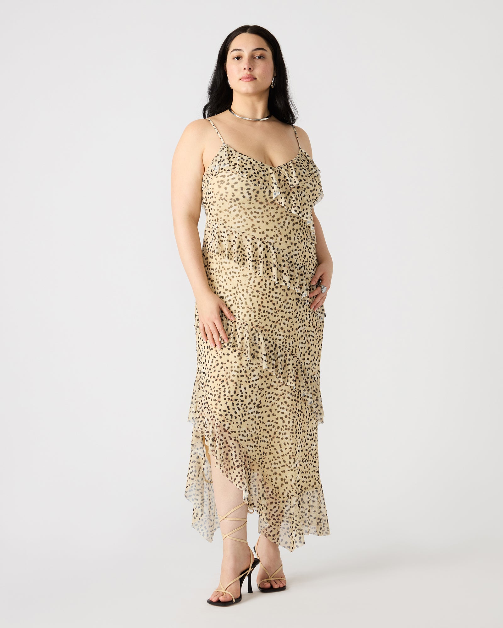 Close-up of the v-neckline on the black sleeveless maxi dress.