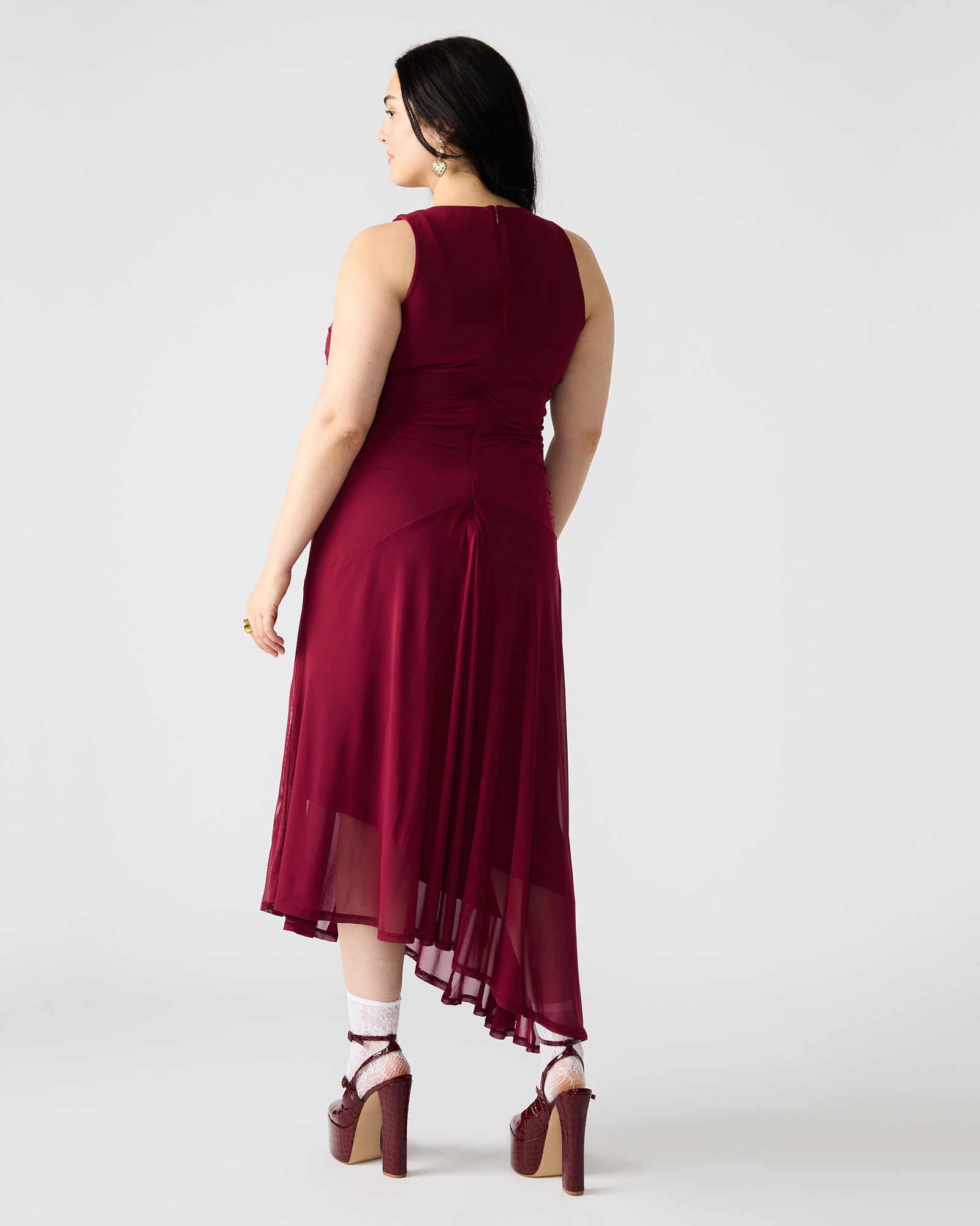 Side angle of the dress, highlighting lightweight fabric and movement