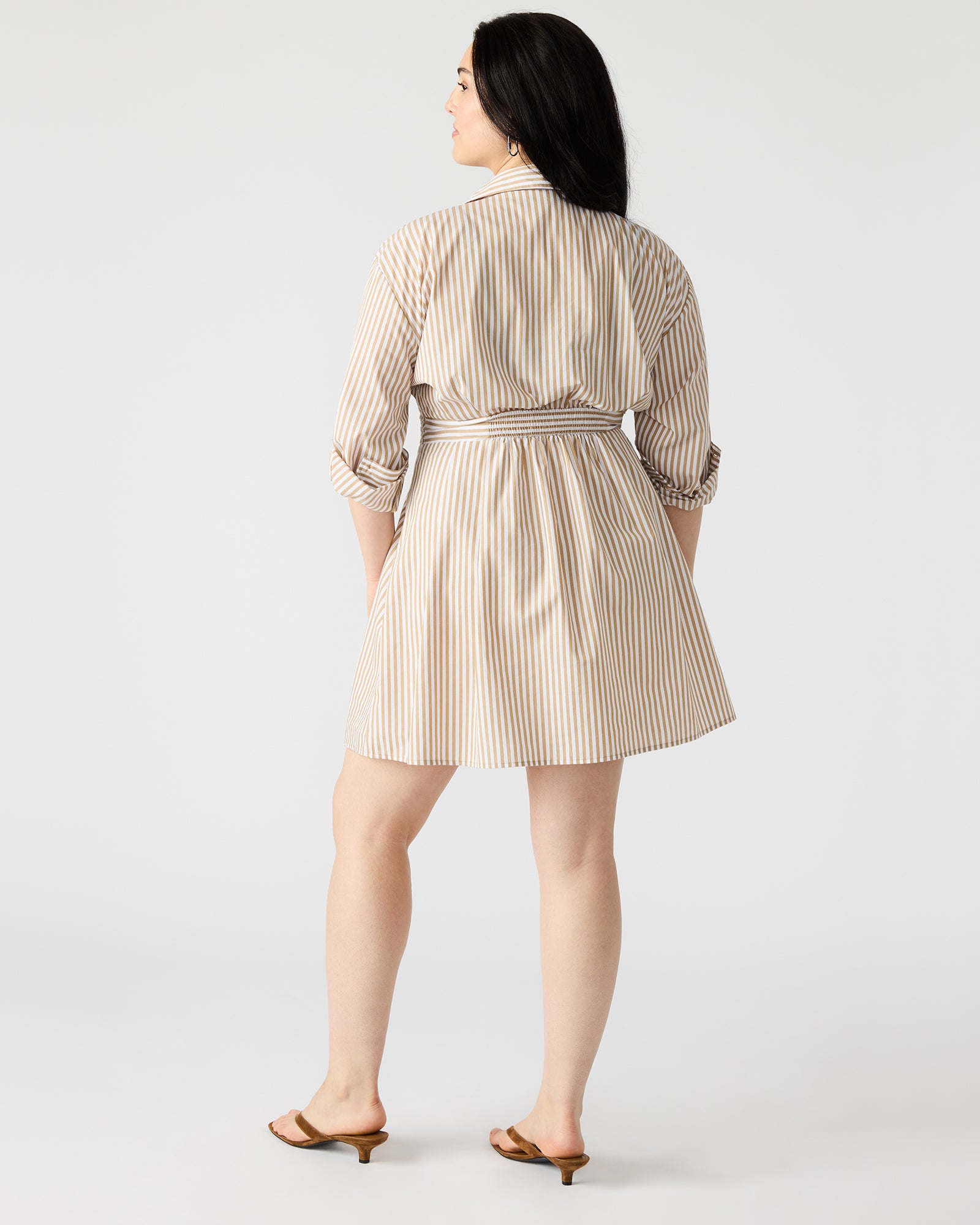 Model wearing the long sleeve mini dress in a casual setting.