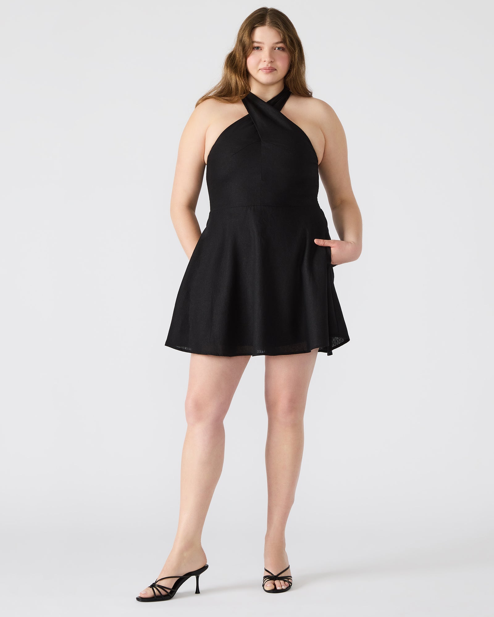 Side angle showing flowy mini dress movement