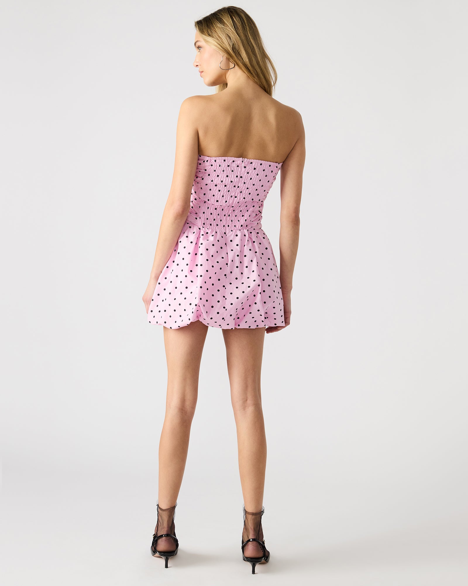 Close-up of polka dot cotton fabric used in pink maxi dress version with similar cut.