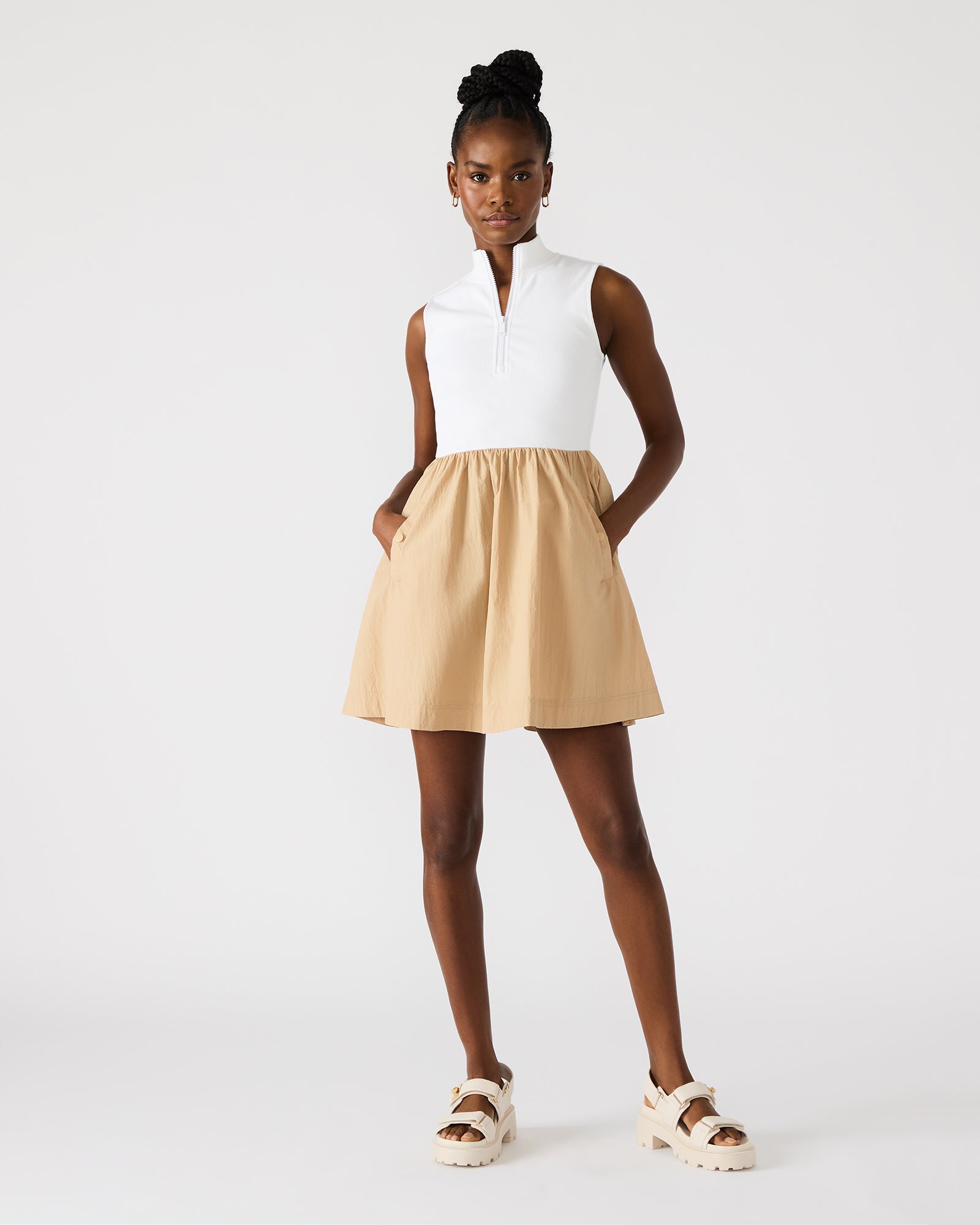 Side angle of long sleeveless dress dress worn outdoors on a warm Charleston morning.