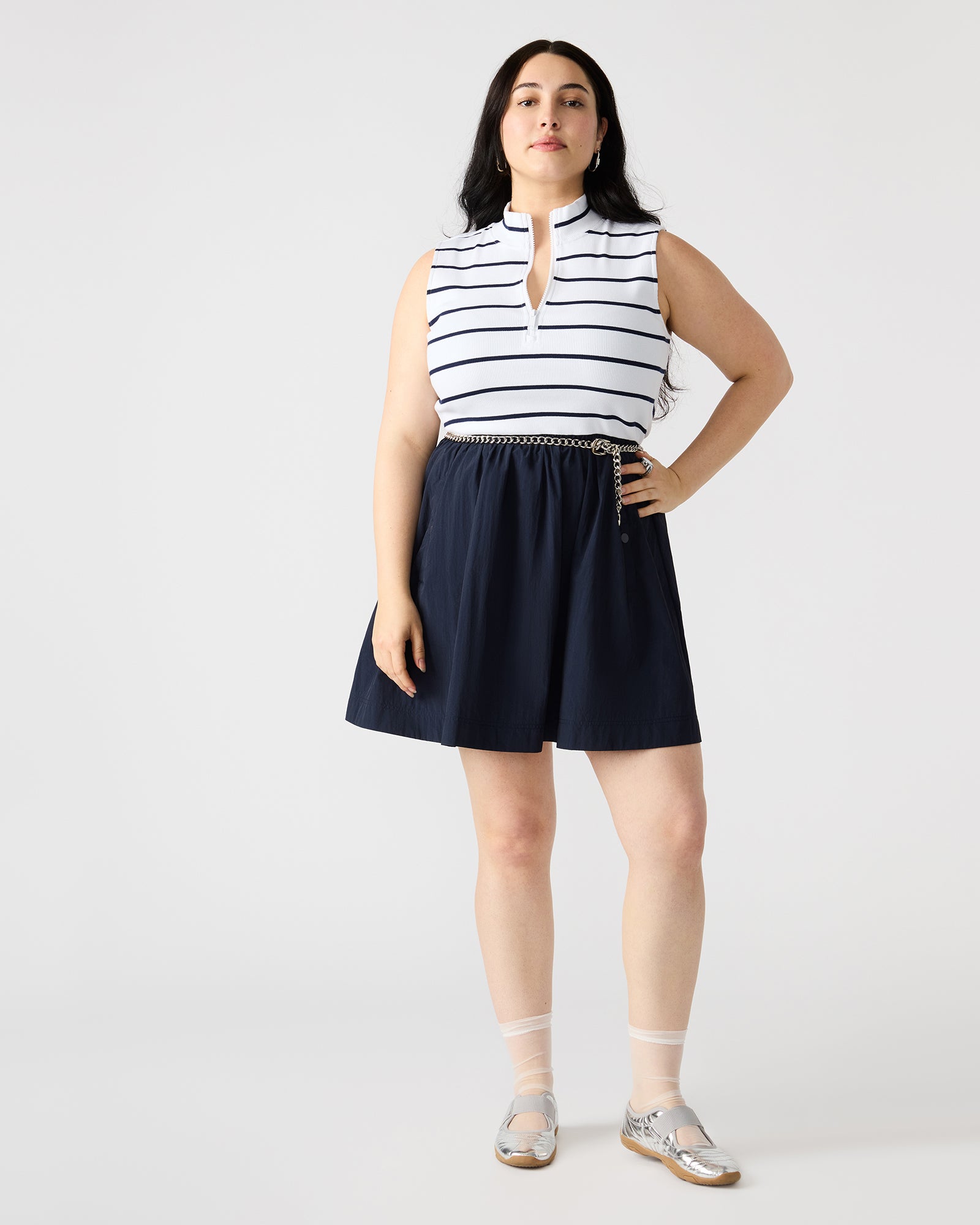 Close-up of Lyon Navy flowy dress showing the collared neckline and sleeveless design