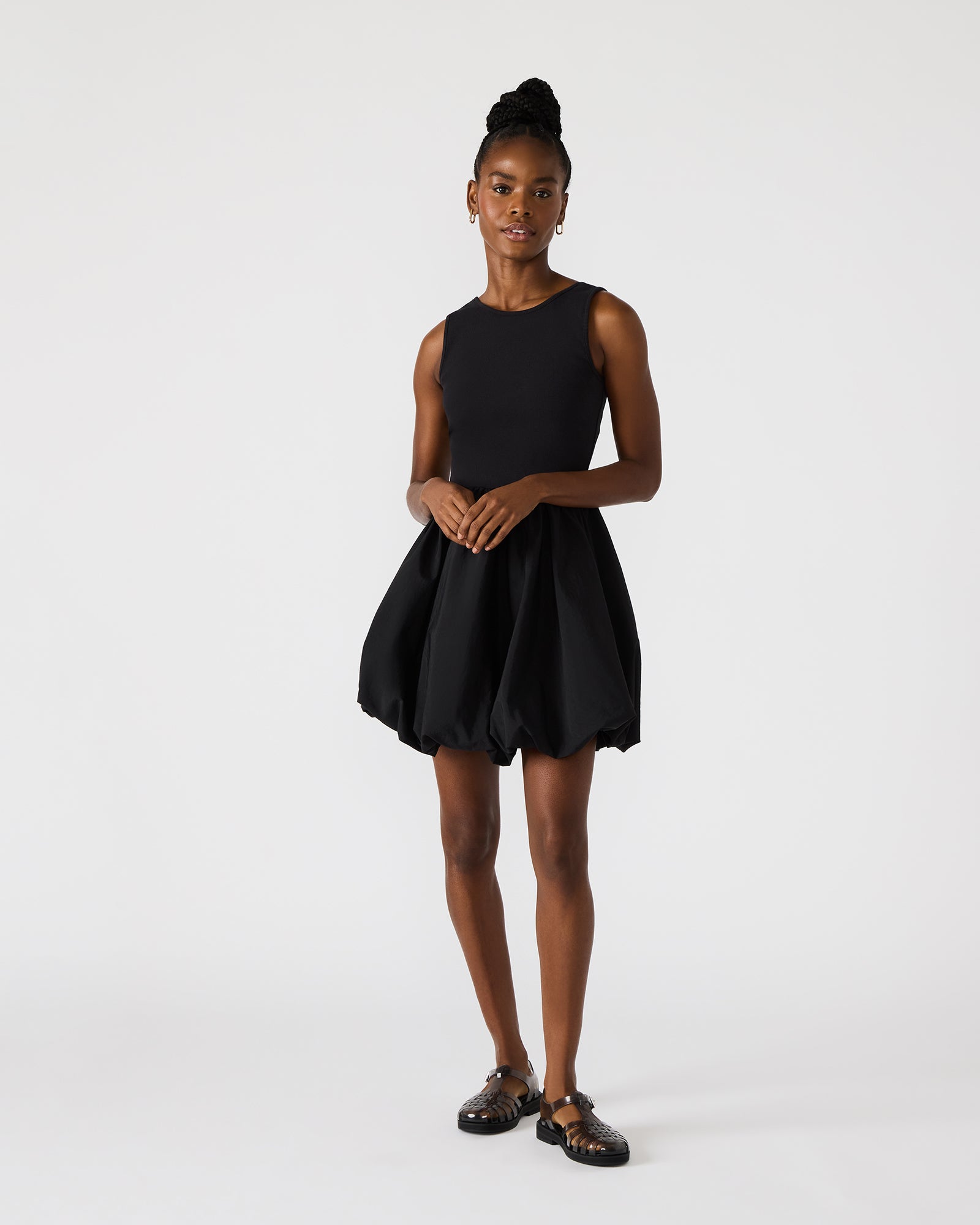 Close-up of the elegant black sequin mini dress highlighting its fabric texture.