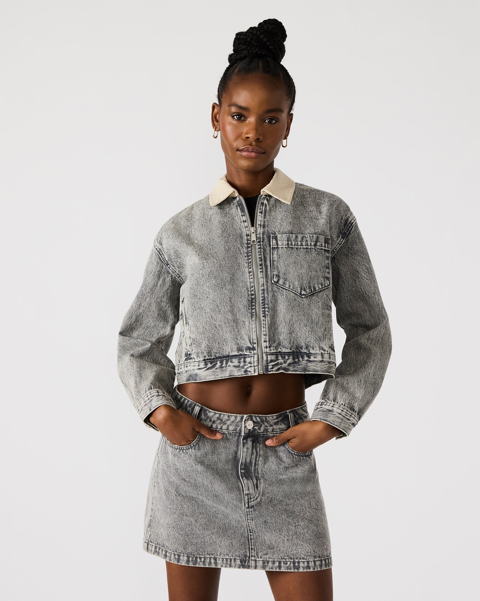 Side view showcasing the collared design of the oversized denim jacket.
